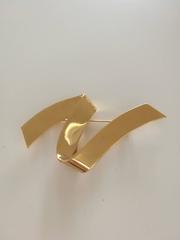 Monet gold tone brooch