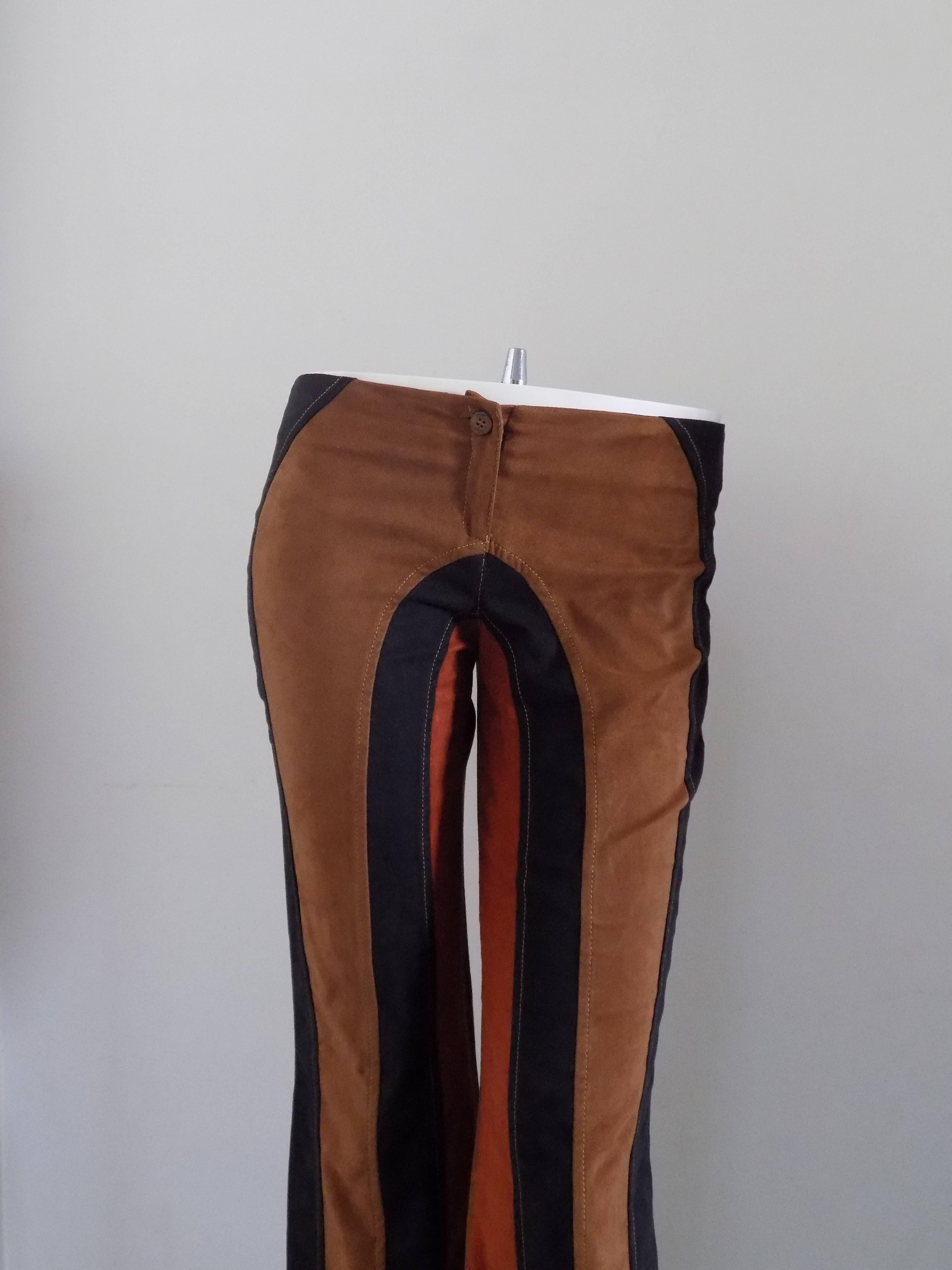 Agostino Martinez Trousers

Brown orange and black trousers totally made in italy in italian size range 44