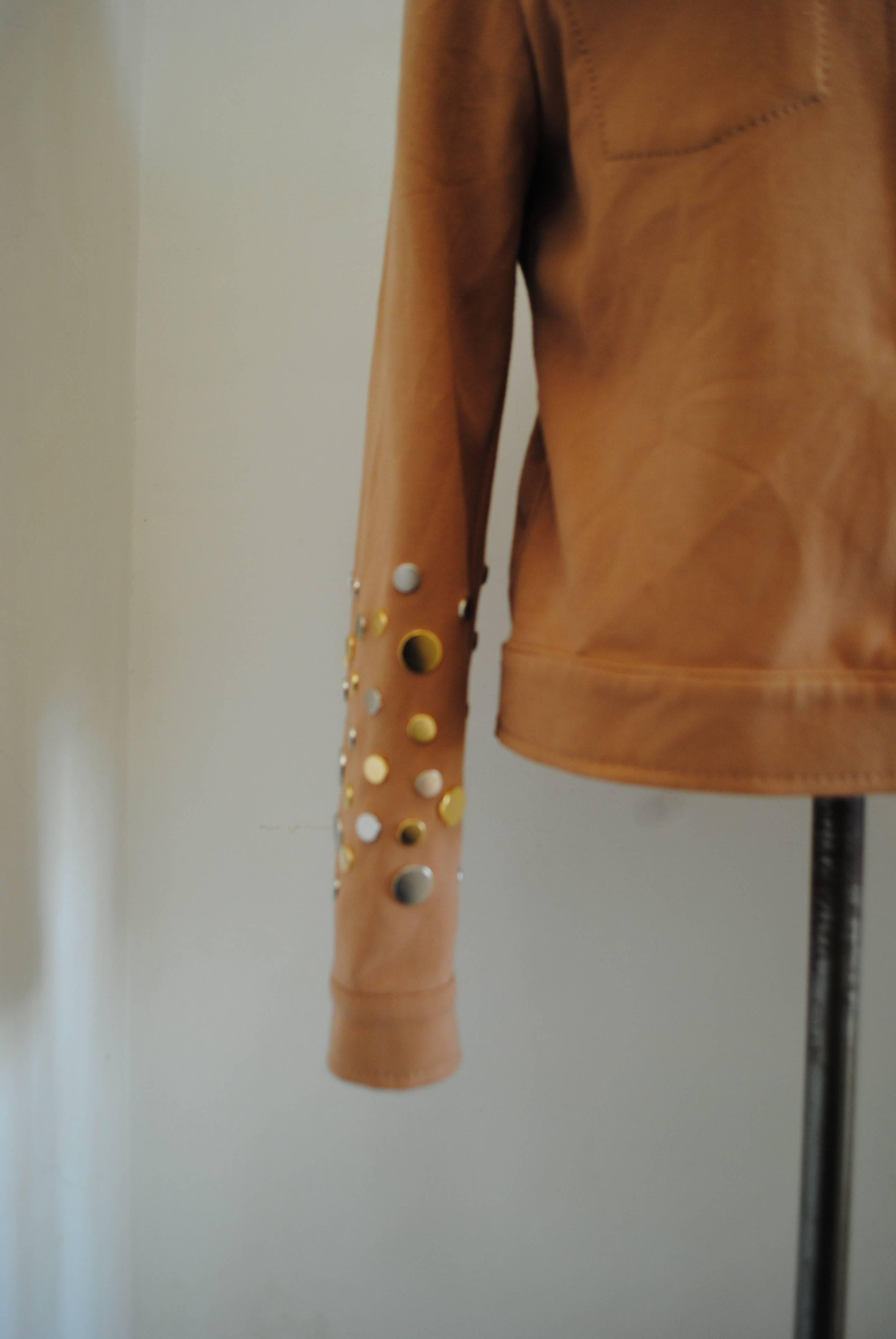 Fendi jacket with studs
Fendi light brown jackets with silver and gold tone studs 
totally made in italy 
Composition: Polyestere and viscose
Size: 42 italian size range