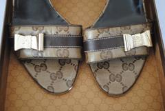 Gucci GG Logo Sandals Gold tone bows