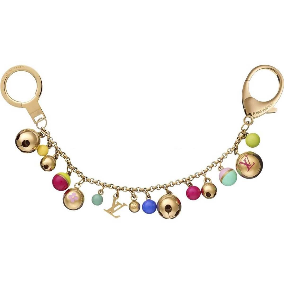 Brass and multicolor Louis Vuitton beaded bag charm with bells, logo charms and logo engraved lobster clasp closure.
Condition: Very Good. Faint scratches and tarnish throughout.