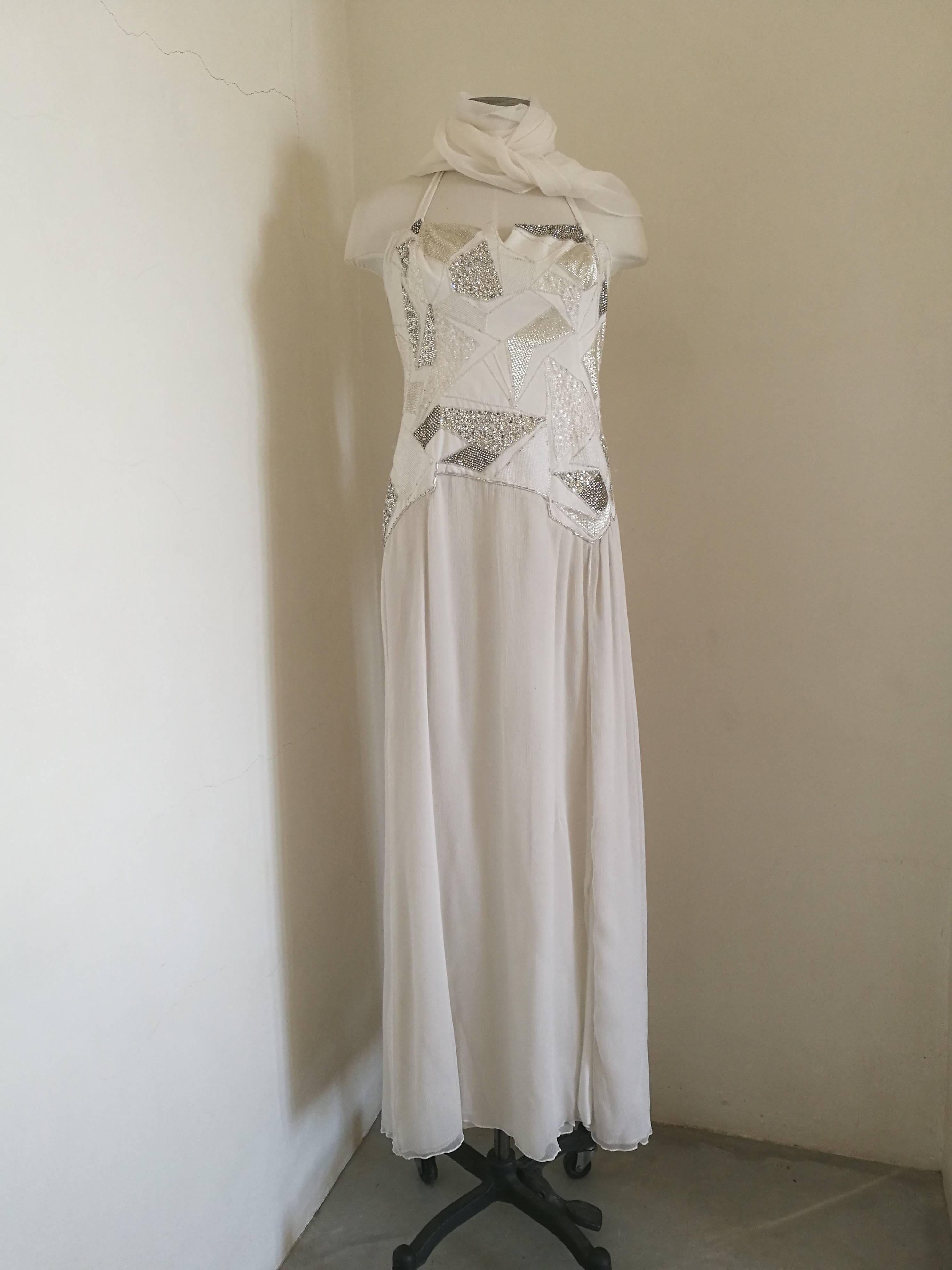 Versace white couture / bridal dress
Embellished with swarovski all over on the front
toally made in italy in italian size range 38