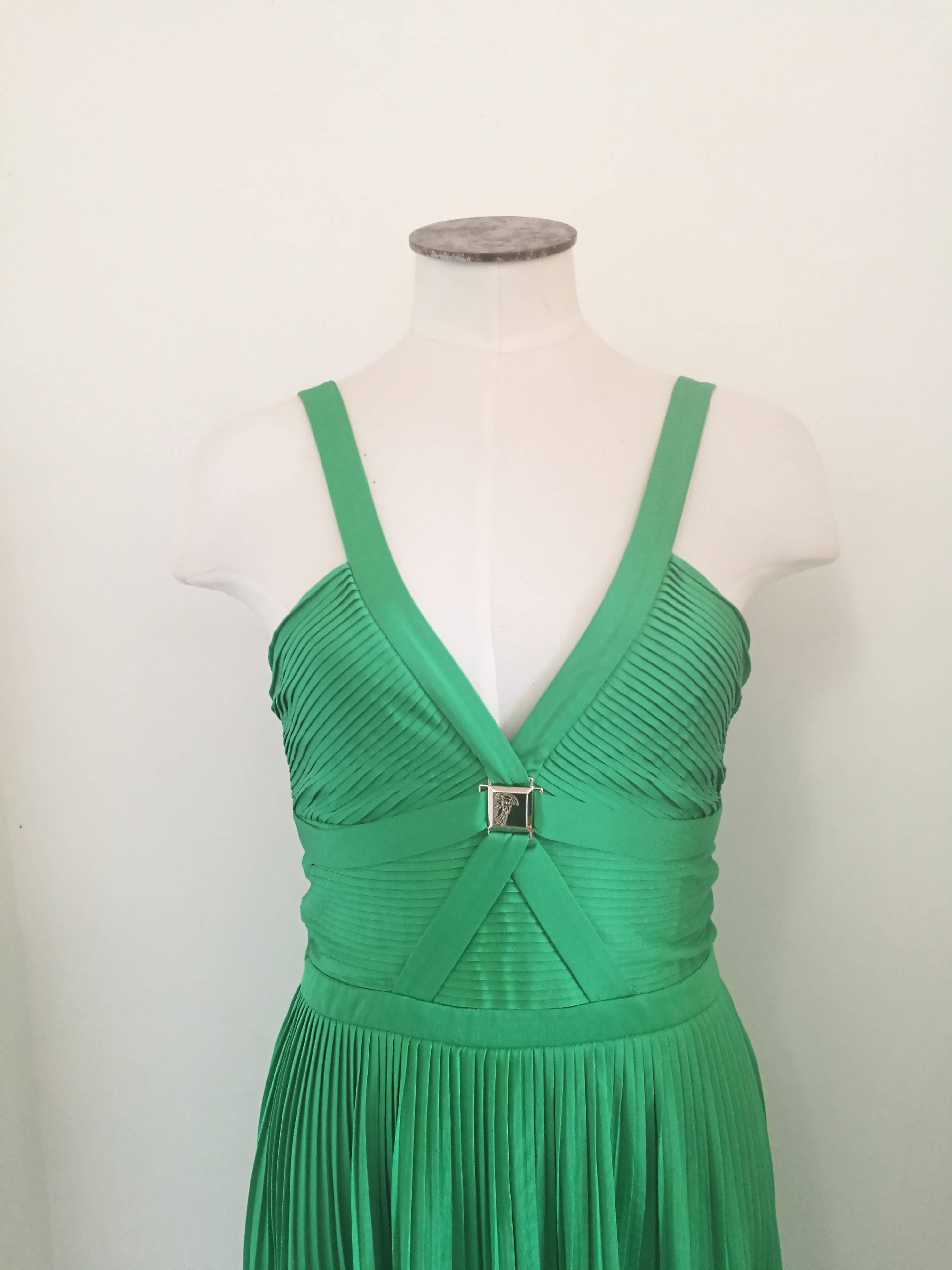 Versace Collection Green jersey dress 
Plissé dress with iconic logo on the front
Totally made in italy in italian size range 40
Composition: viscose 73% poliestere 27% 
Retail price: more then 3k