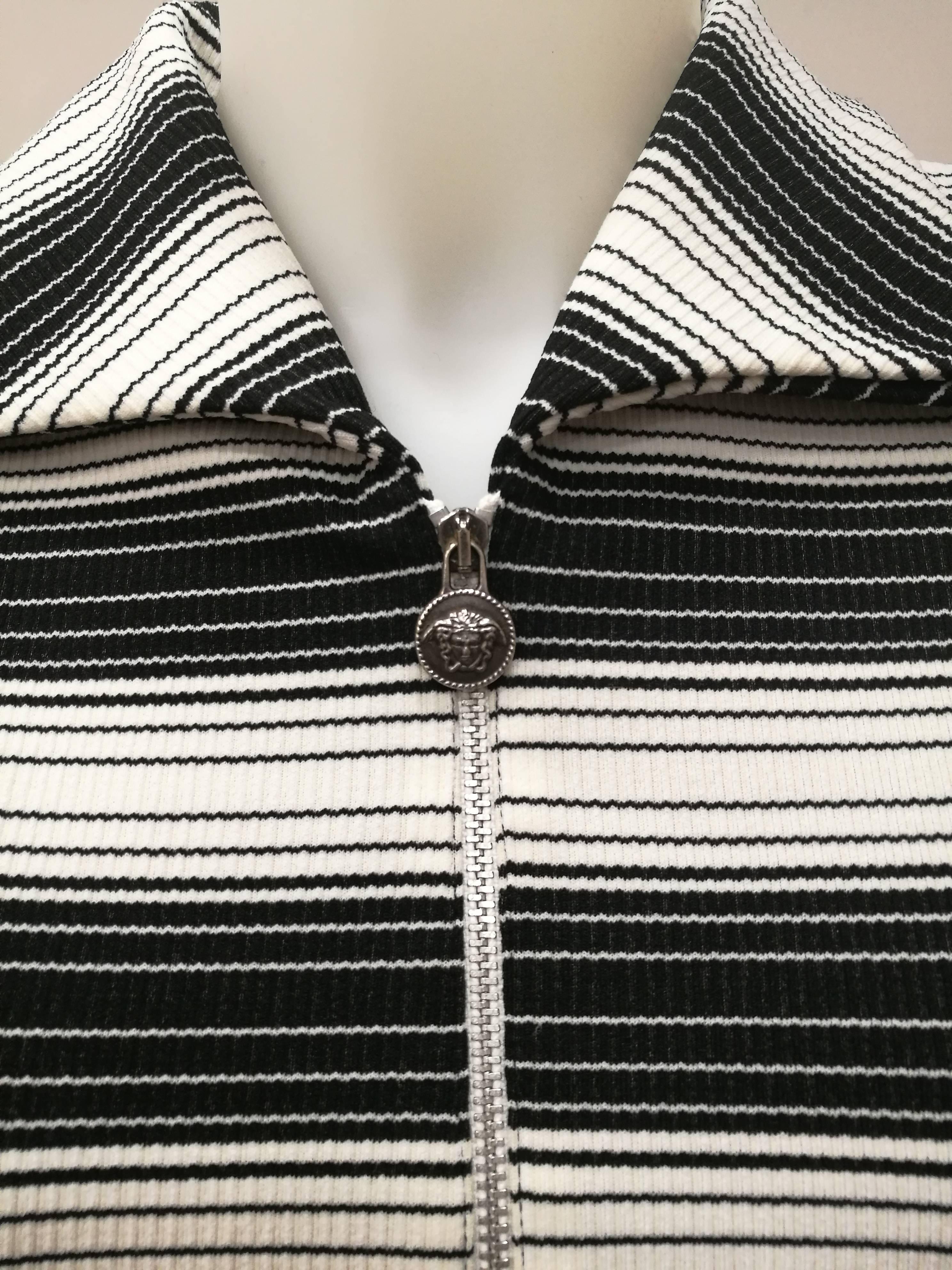 Versace Jeans Couture Black & White Stripes Jacket

Versace serial number limited edition jacket 255630

Totally made in italy in italian size range M

Composition: 92 polyestere 8 elastane