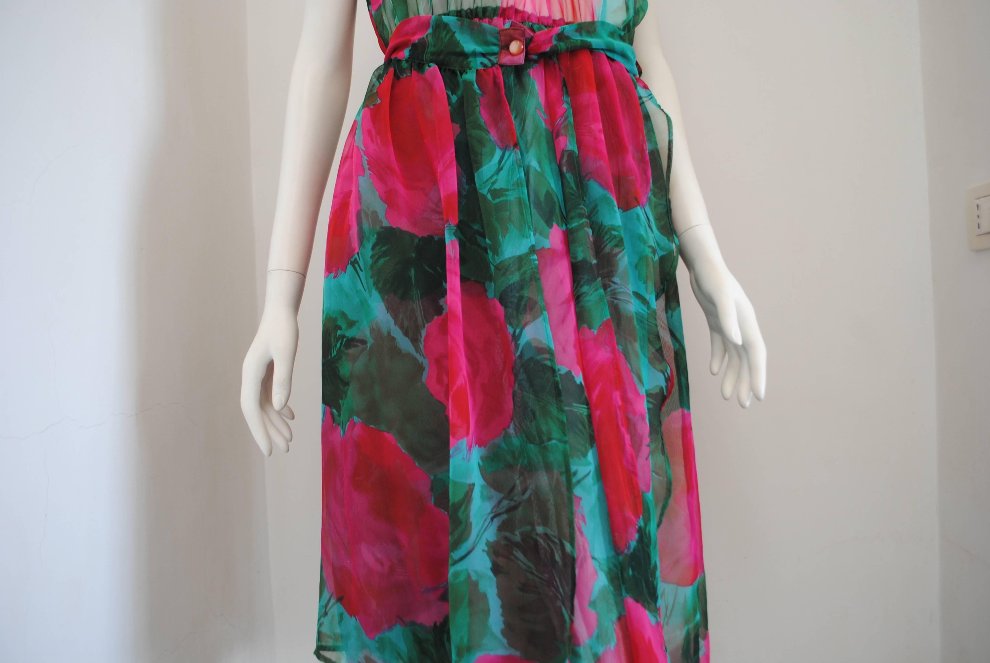 1980s Vintage Green Flower Dress

Green with fucsia flowers all over vintage dress. See through bust with belt embellished by pink botton.

Composition: others

Totally made in italy in italian size range 42