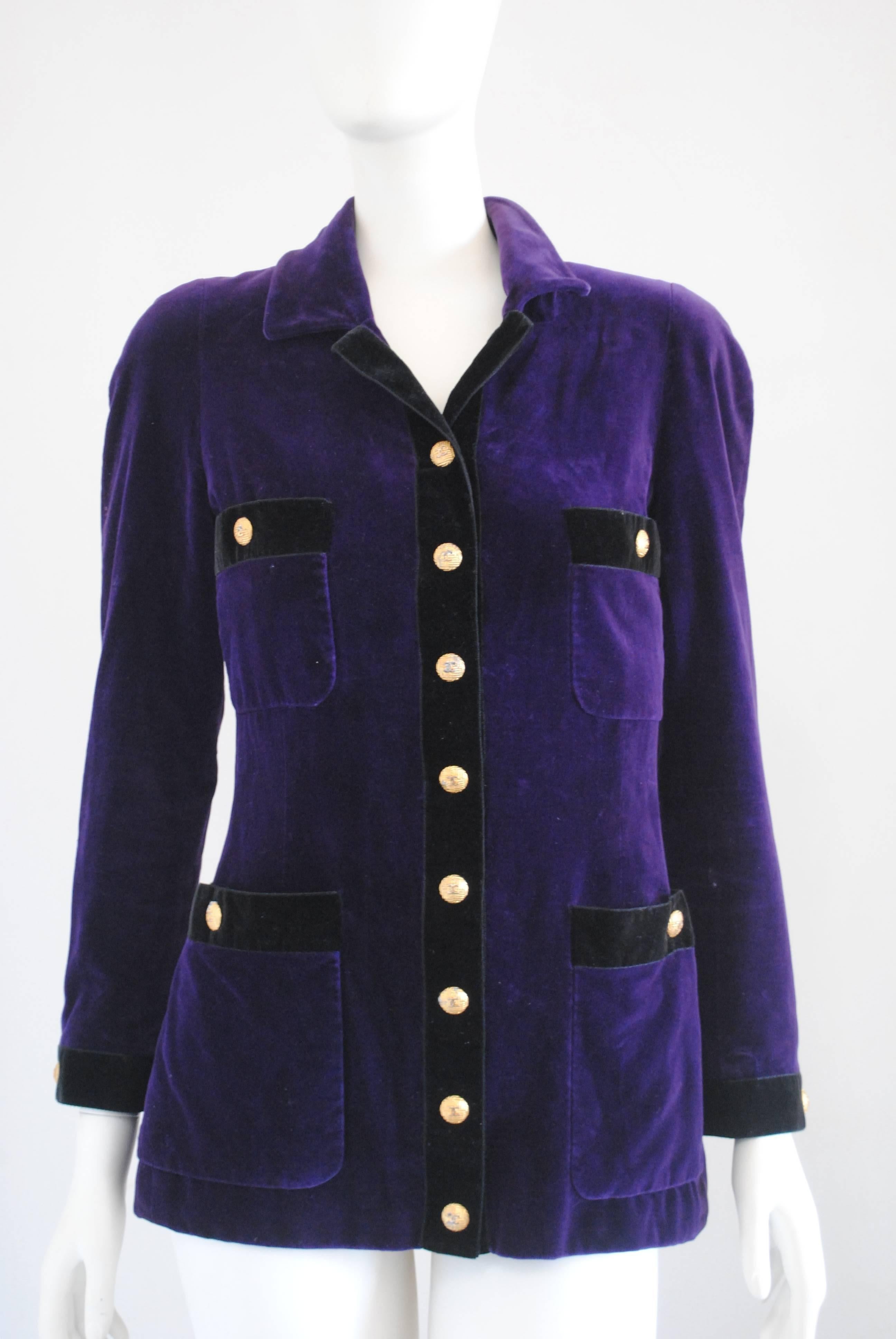 1980s Chanel Boutique Purple Black Velvet Jacket
Purple black jacket embellished with gold tone bottons 
2 tasks on the front
Please note that vintage items can have imperfections due to age and wear
Totally made in France in french size 38 which