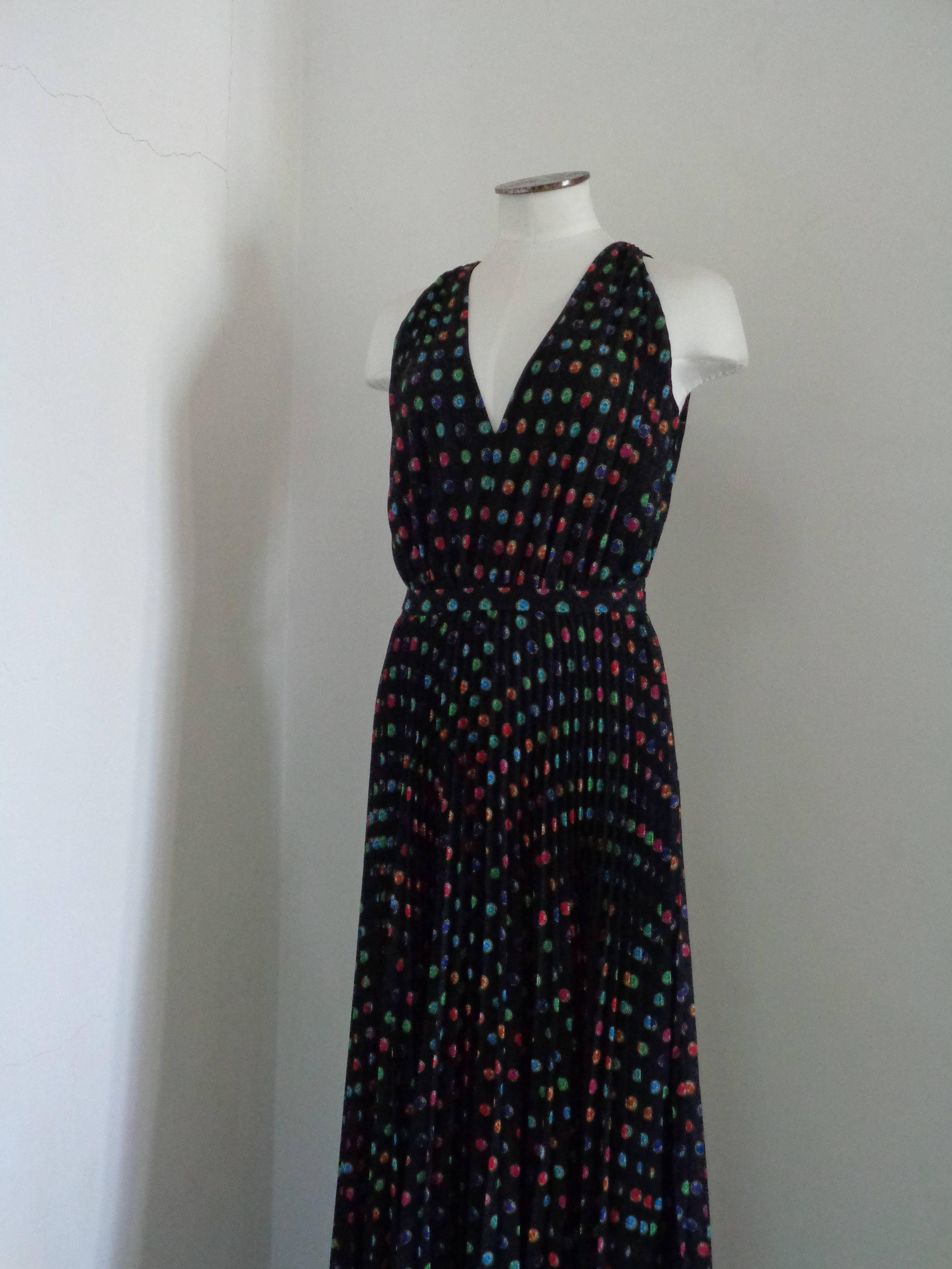 Boutique Moschino Black Long Dress Swarovski Print NWOT

Composition: Cotton & Polyestere

Size 42 in italian size range