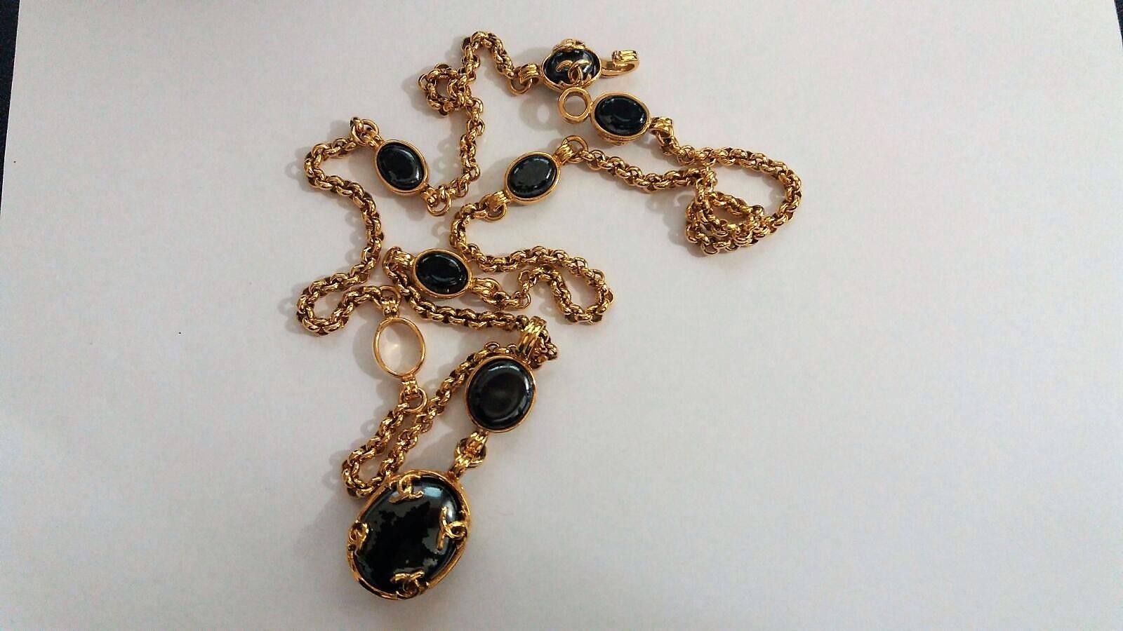 gold necklace black stone