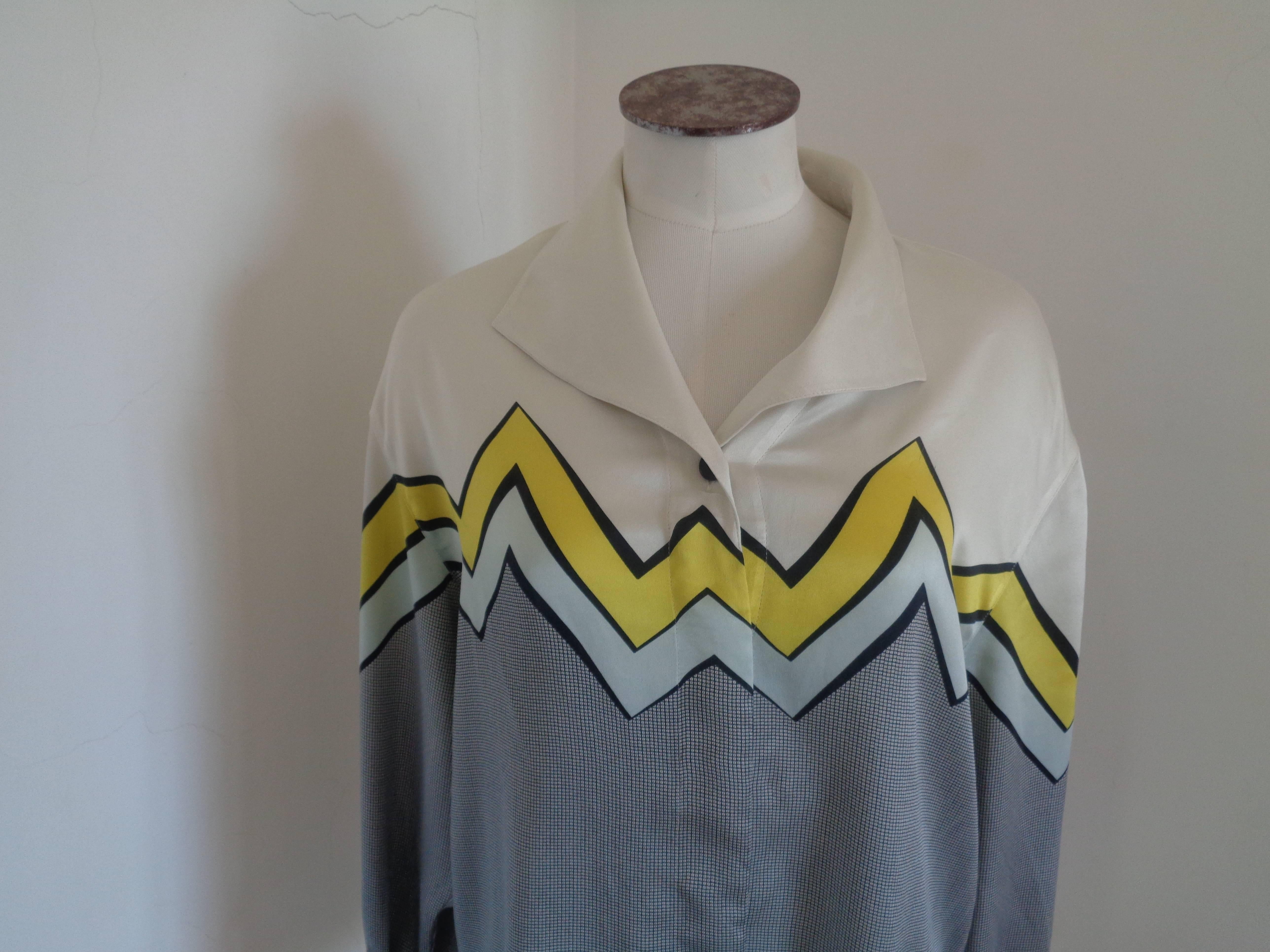 Escada by Margaretha Ley Silk Shirt

Grey white and yellow grey shirt by Escada 

Composition: Silk

Size: 46