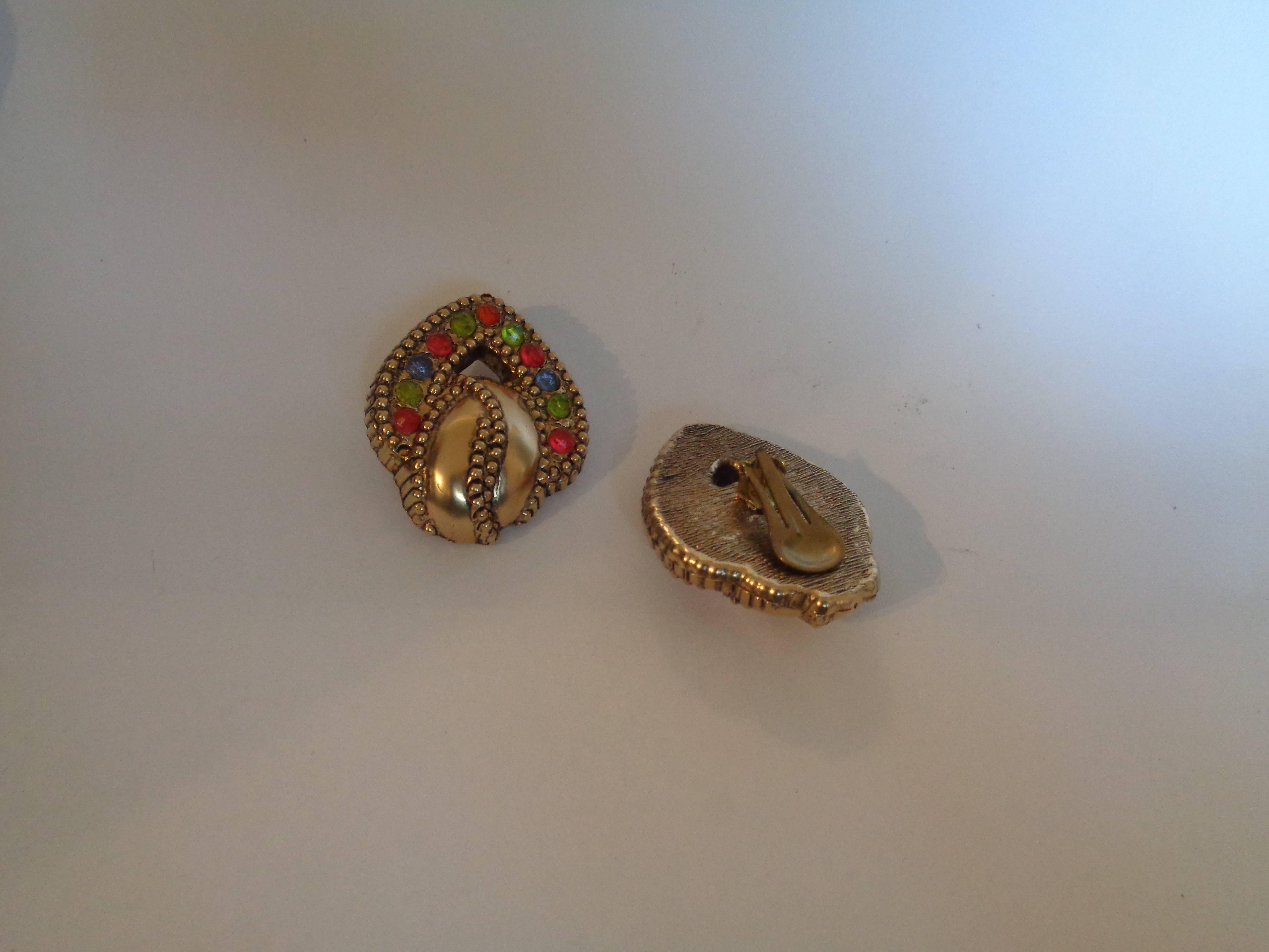 1970s Gold Tone Clip on earrings

With multicoloured Swarovski