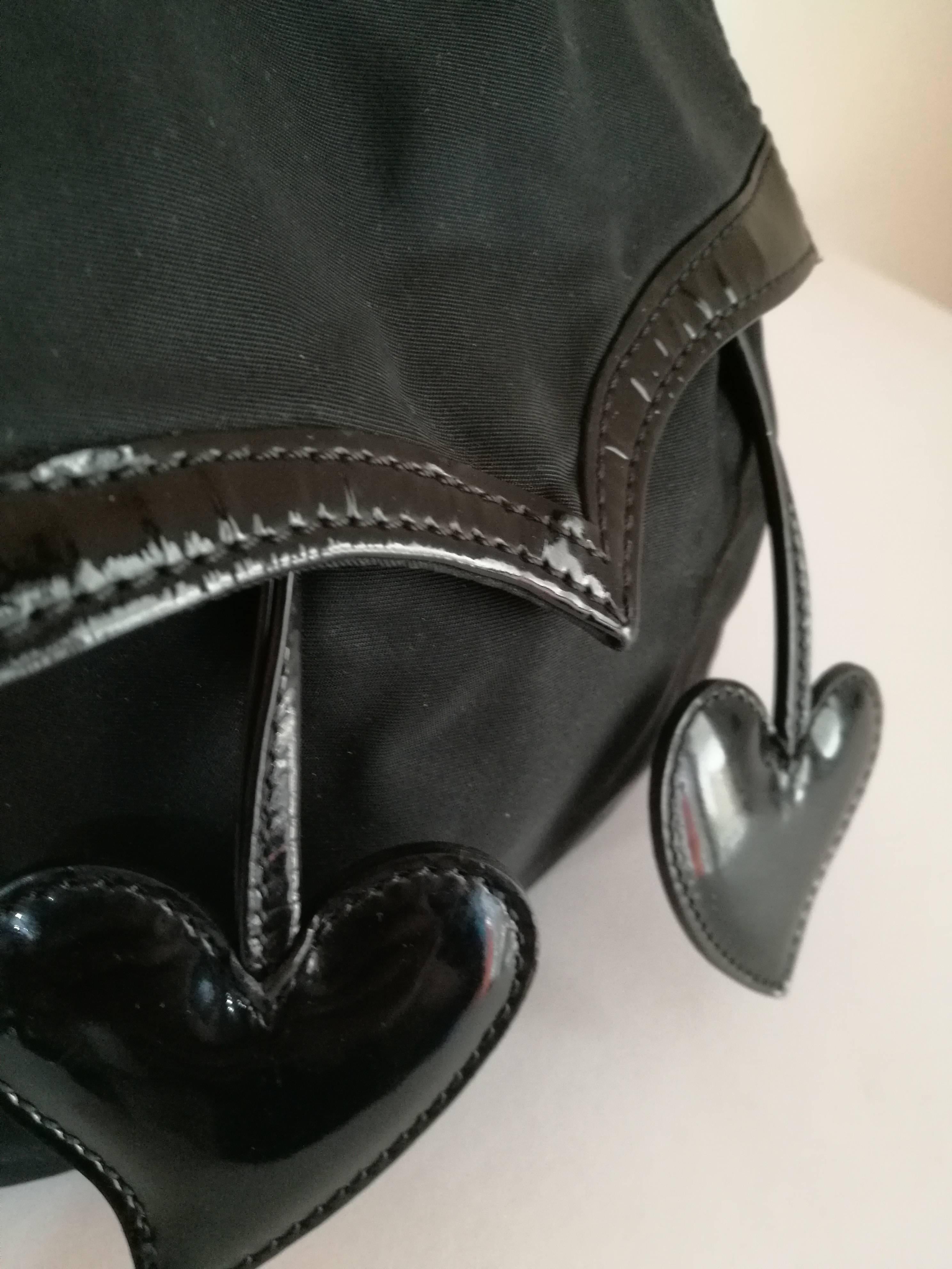 Christian Lacroix Black Hearts Backpack

Totally made in france

Gold tone hardware

height 30 cm

depth 11.5 cm

widht 19 cm