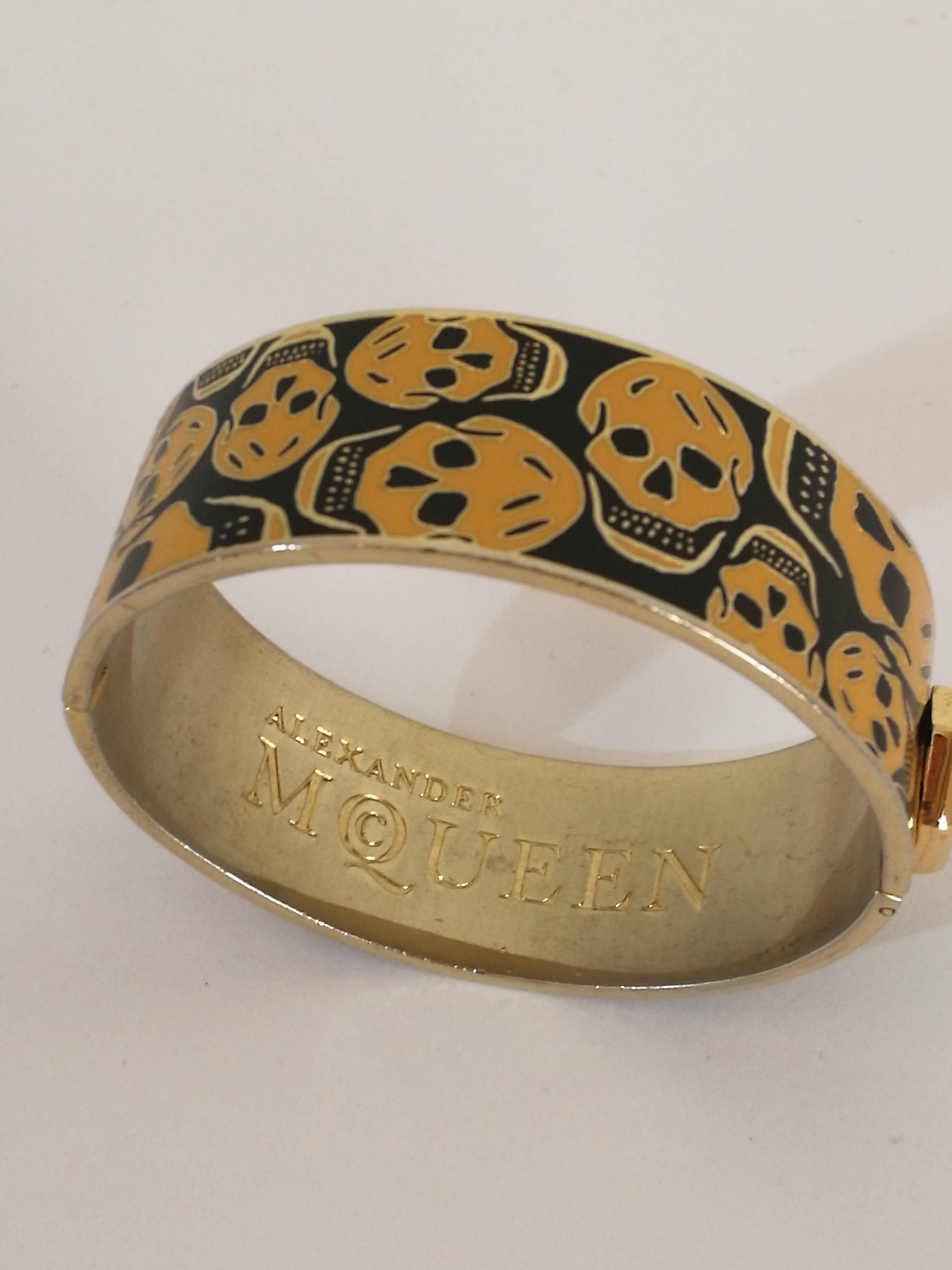 Alexander McQueen Gold tone Skulls black Bracelet

