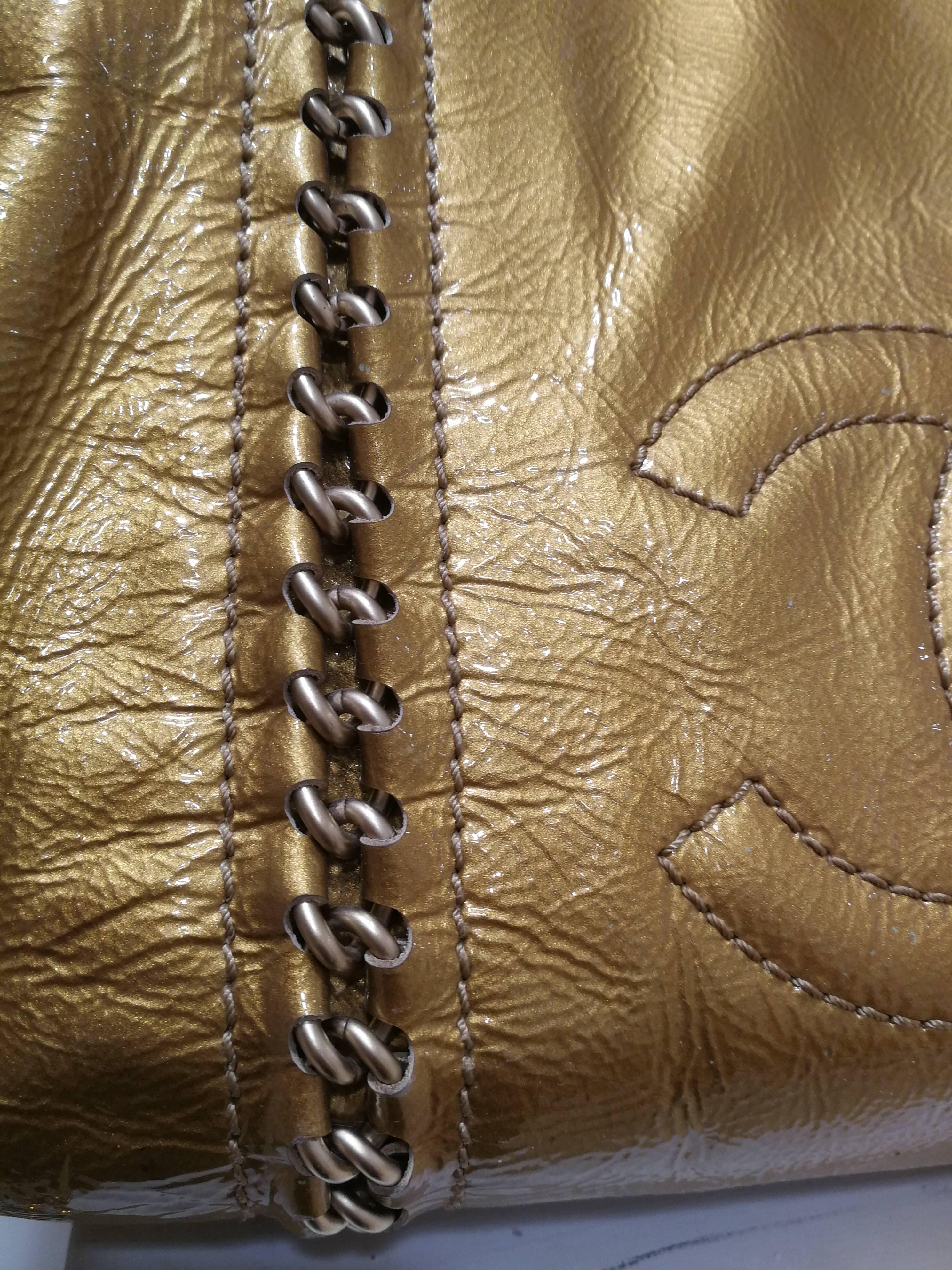 Women's or Men's Chanel gold patent leather shoulder bag