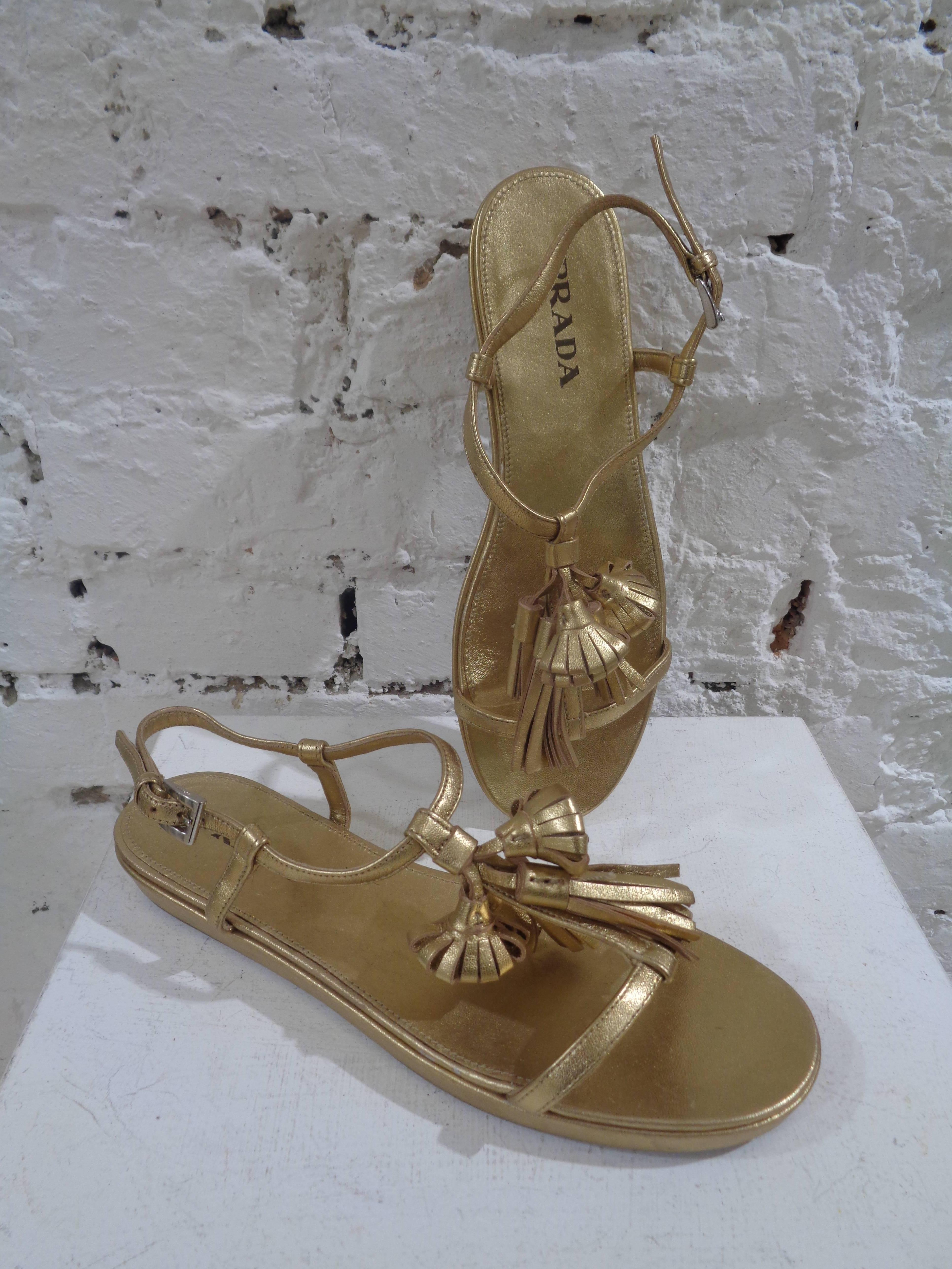 Prada gold leather sandals

unworn gold tone leather Prada shoes in size 36 and totally made in italy