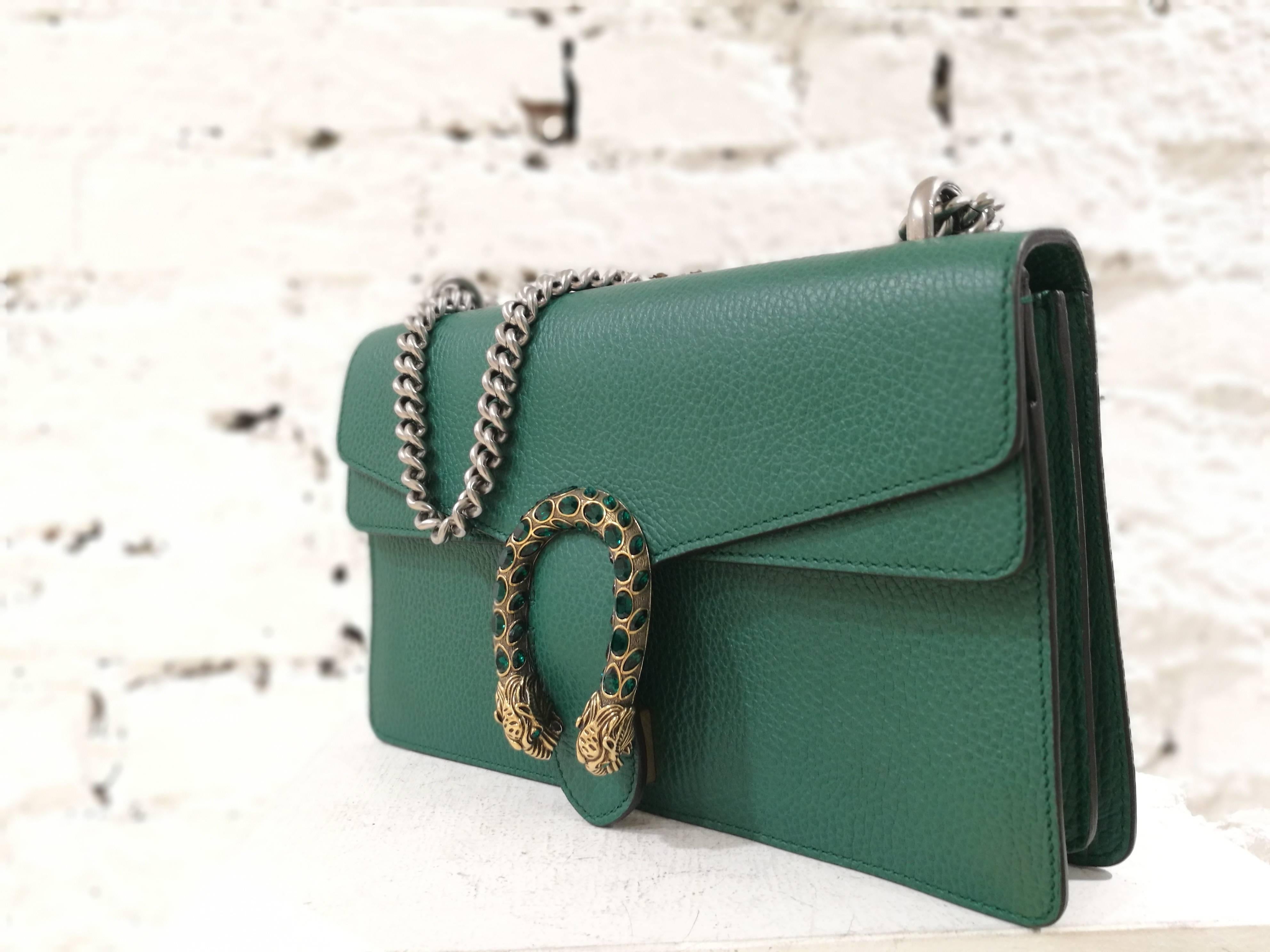 Gucci green leather Dionysus Bag

silver tone chain, gold tone hardware
unworn
