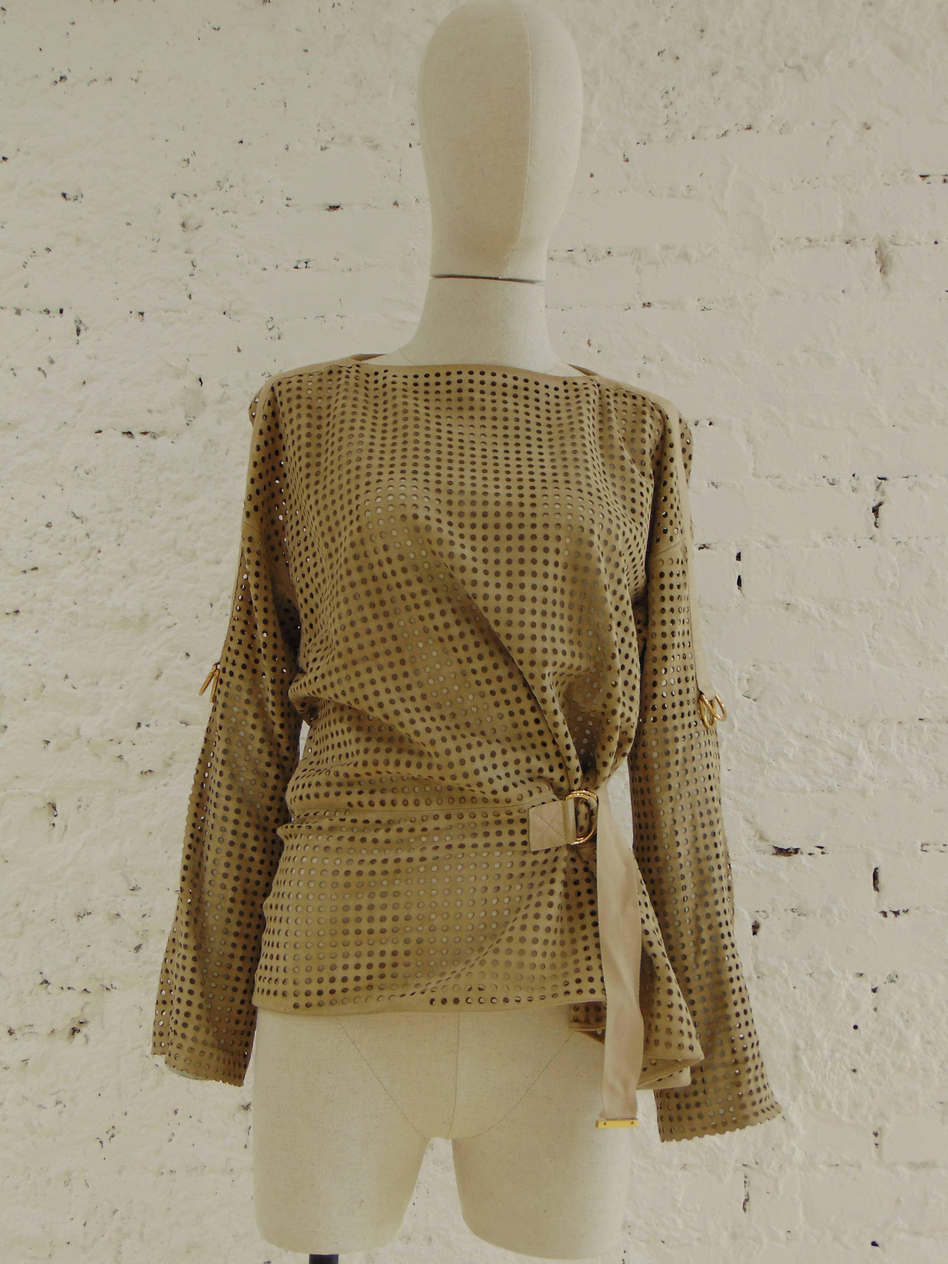 Tom Ford beije leather shirt 

perforated leather in beije nude tone shirt
totally madei n italy in size 44
embellished with gold tone hardware belt closure
