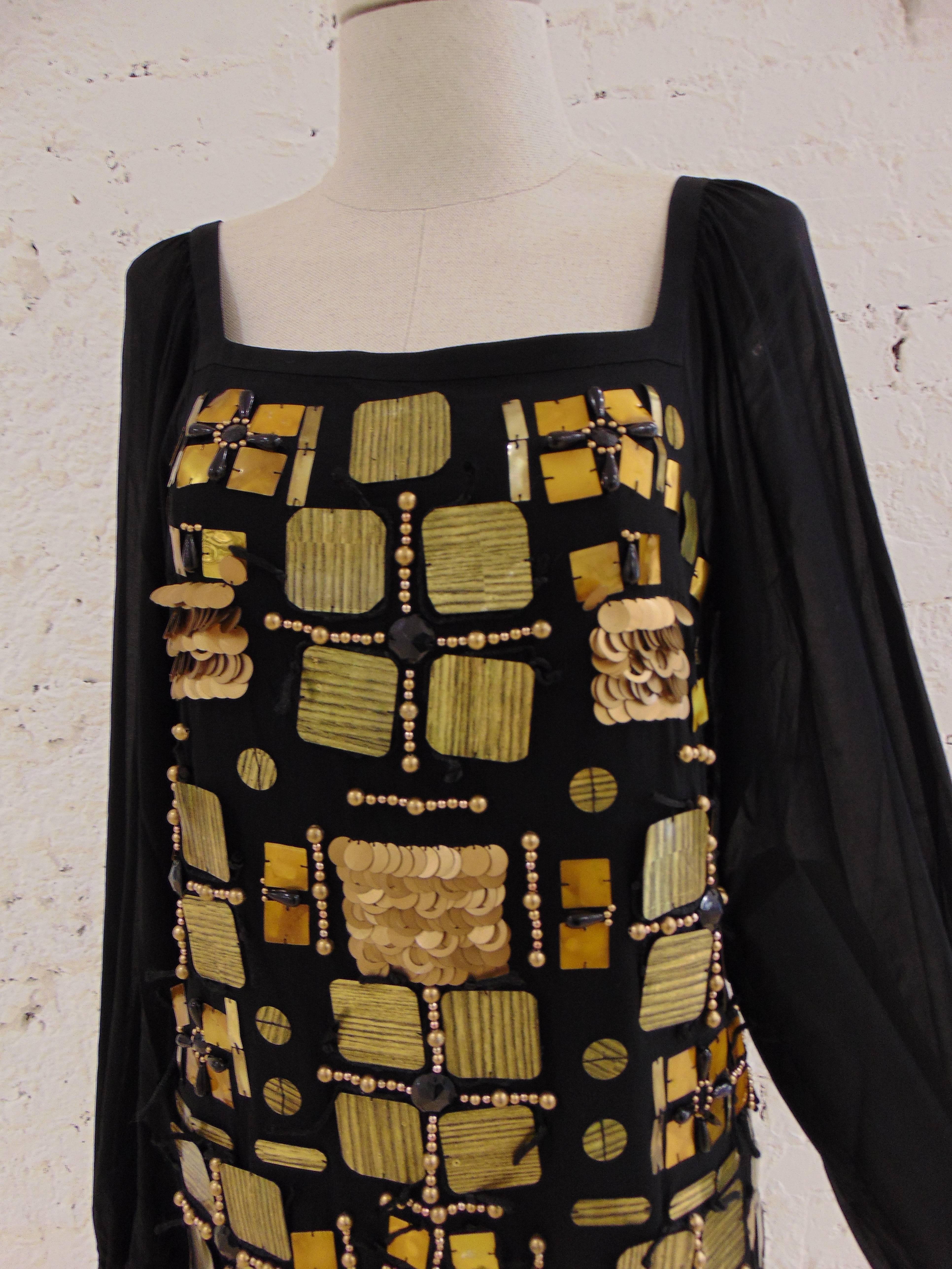 Emilio Pucci black dress with gold tone and black sequines
totally made in italy 
long see through sleeves

size 42

composition silk