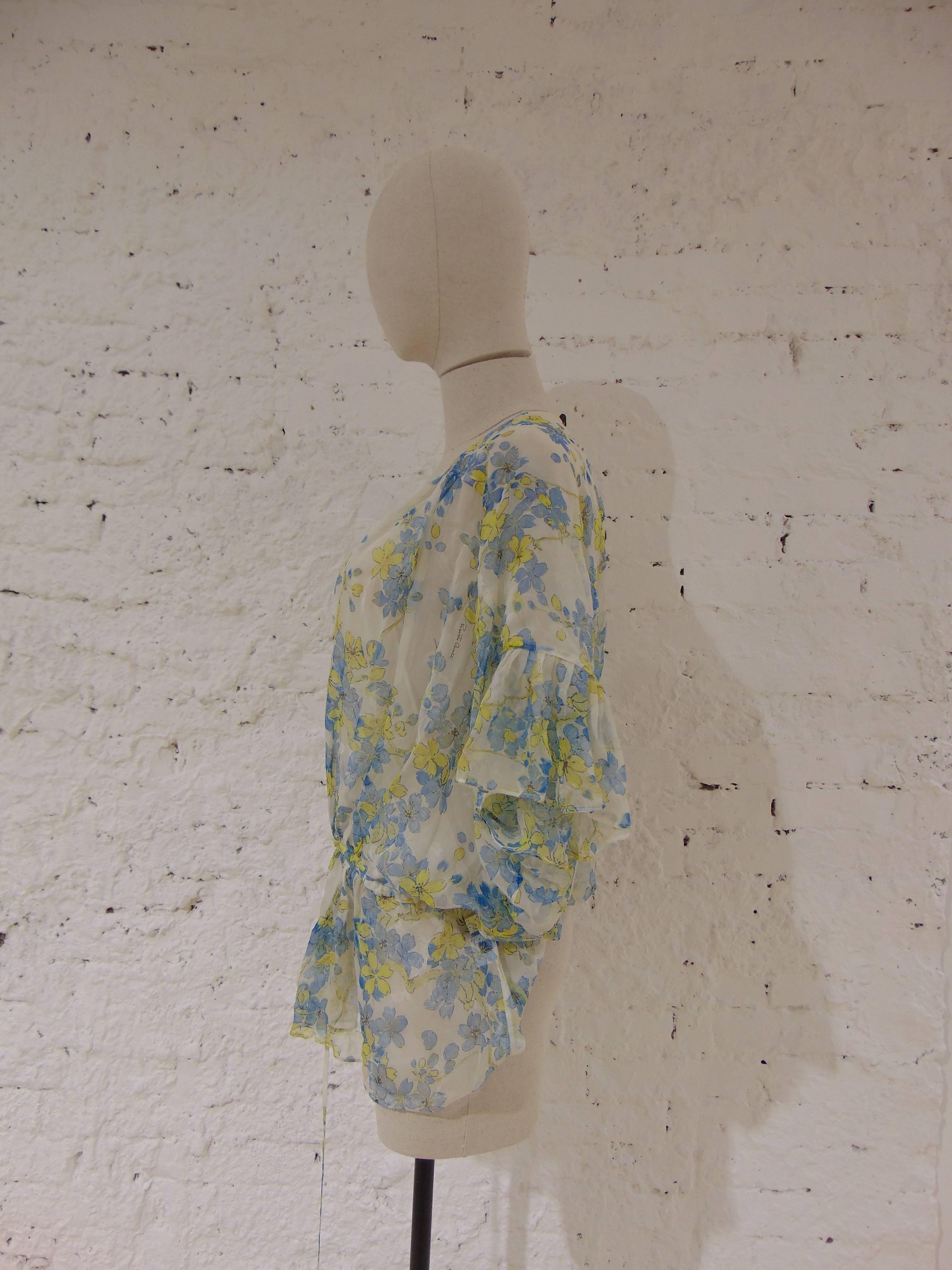 Roberto Cavalli see through flowers blouse

totally made in italy in size 42

composition: silk