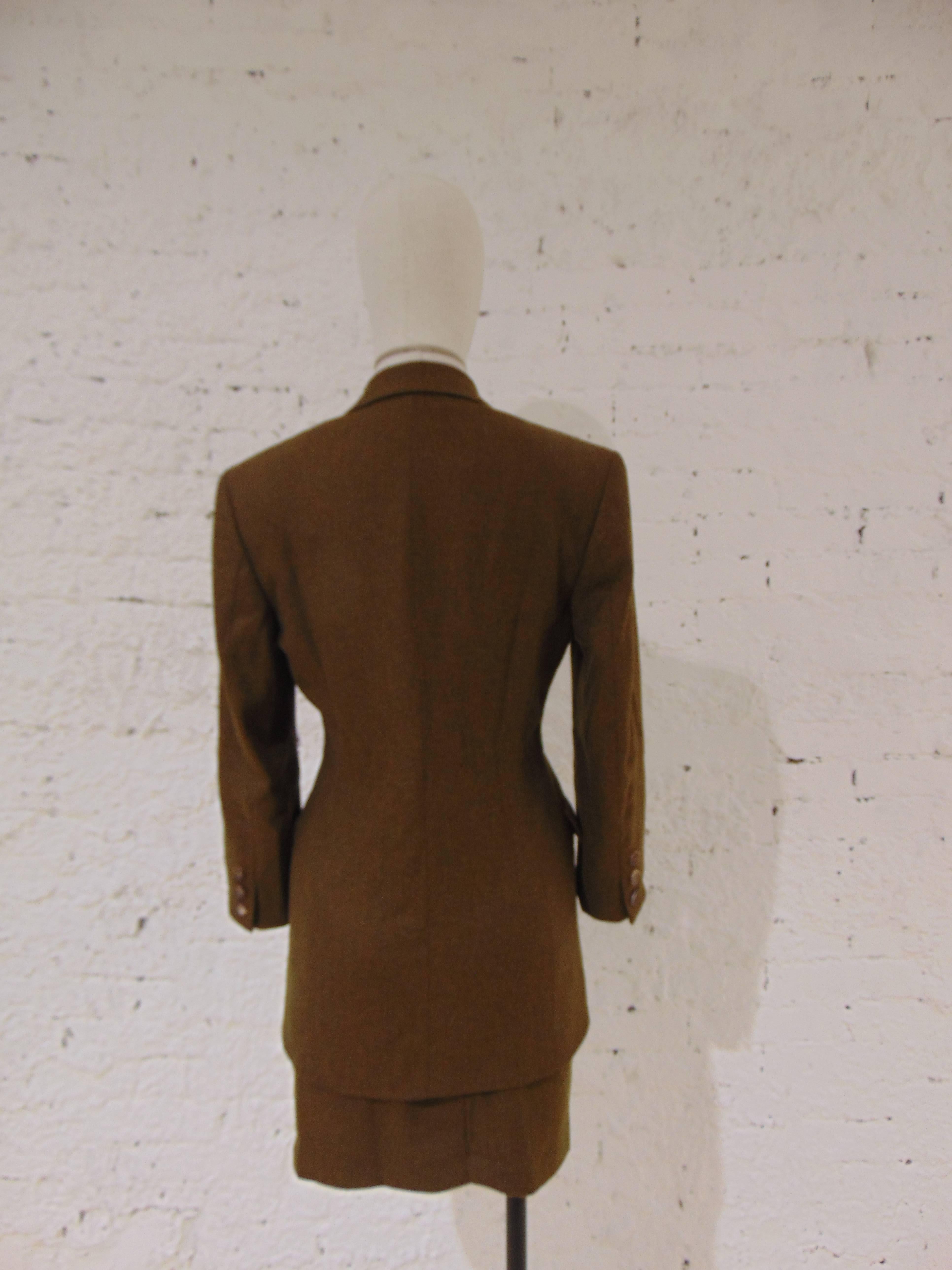 Prada brown skirt suit

totally made in italy in size 40