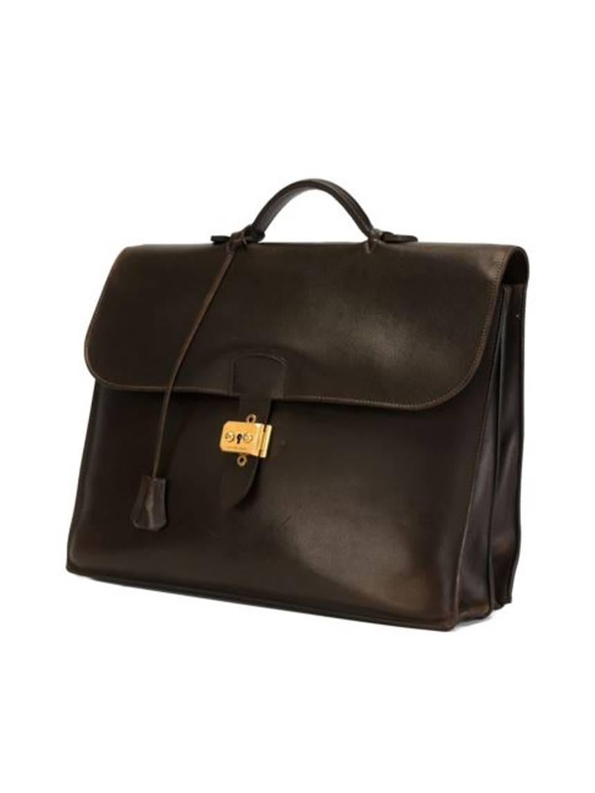 Gorgeous Hermes chocolate epsom lamb leather briefcase « Sac à Dépèches »  featuring a satchel body, foldover top with twist-lock closure, gold plated hardware, original clochette, key, a top handle, two internal compartments and an internal logo