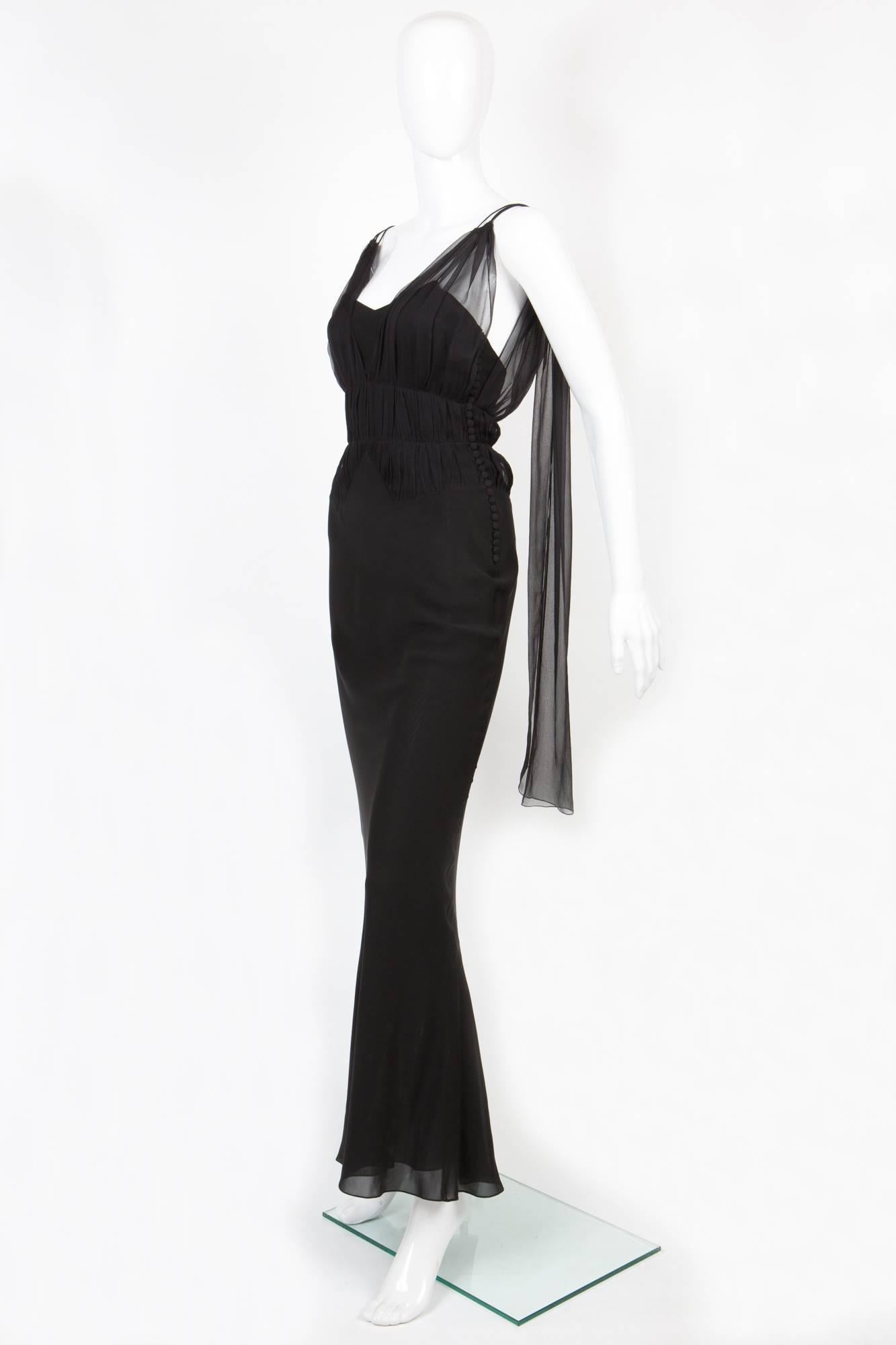 Christian Dior by Jonh Galliano black silk draped evening dress featuring a v-neck, spaghetti straps, a deep V back, a fitted silhouette, a flared skirt and a long length. 
In excellent vintage condition. Made in France.
Estimated size: 36fr
We