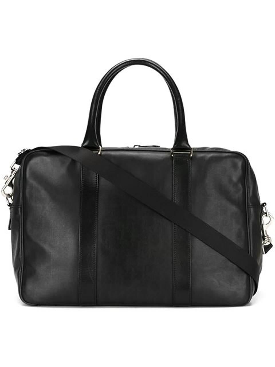 Christian Dior black leather monogram canvas briefcase  featuring black boxcalf leather handles & details, iconic Dior monogram pattern, a front slip pocket, silver-tone hardware, round top handles, a detachable and adjustable shoulder strap, a top