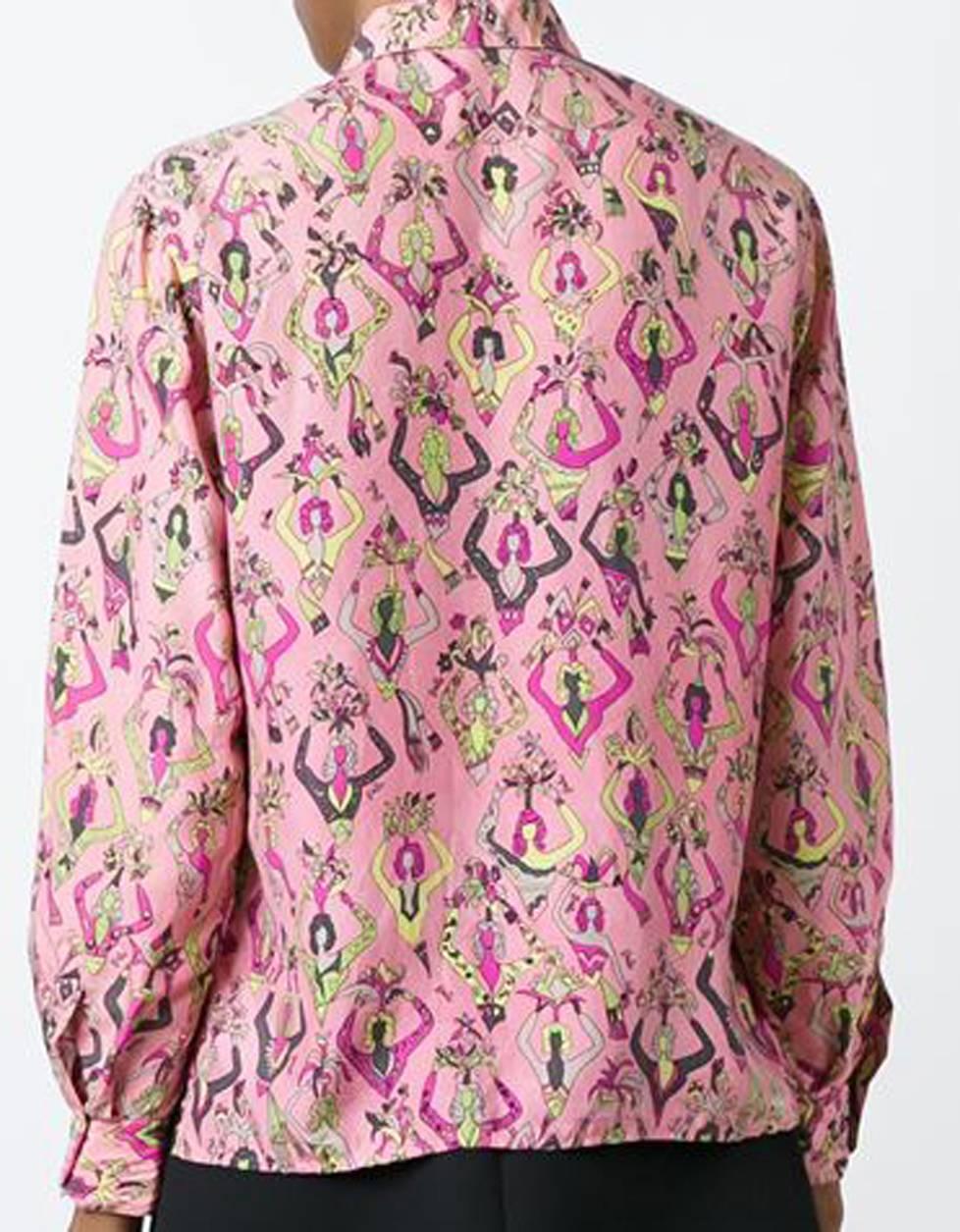 Gorgeous 1960s Emilio Pucci  pink and multicolour silk printed shirt featuring a classic collar, a front button placket, long sleeves, button cuffs, side slits, a straight hem and an all over dancers print. 
In excellent vintage condition. Made in