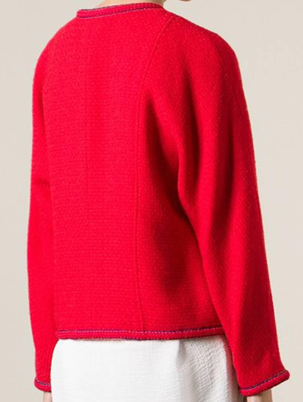 Chanel red wool classic bouclé jacket featuring a collarless design, long sleeves, two chest pockets and a cropped length. 
In excellent vintage condition. Made in France.
Estimated size:38fr
We guarantee you will receive this gorgeous item as
