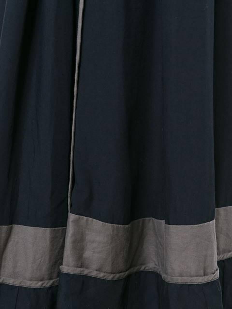 1998s Comme des Garcons taupe and navy blue two-tone pleated dress featuring taupe patches, a center back zip.
Rayon 100%
In excellent vintage condition. Made in Japan.
Label Size S
We guarantee you will receive this gorgeous item as described and