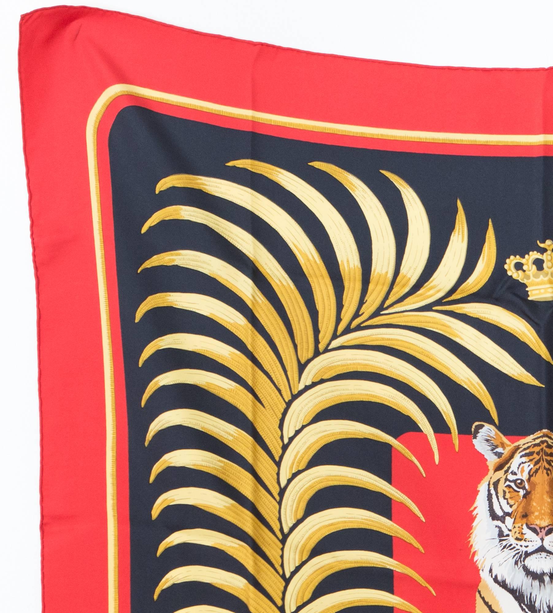 Originally issued in 1977, Hermes Tigre Royal by Christiane Vauzelles has become an iconic, highly coveted Hermes print. The 'Tigre Royal' features a regal tiger at the center surrounded by a golden wreath on a black background. Marked Hermes Paris.