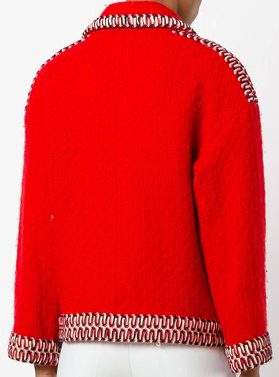 Chanel red wool boucle jacket featuring a boxy shape, a fancy contrasted large ribbon, center front gold-tone logo buttons opening, 2 patched pockets, a silk lining. 
Composition: 55% wool, 45% polyamide 
In excellent vintage condition. Made in