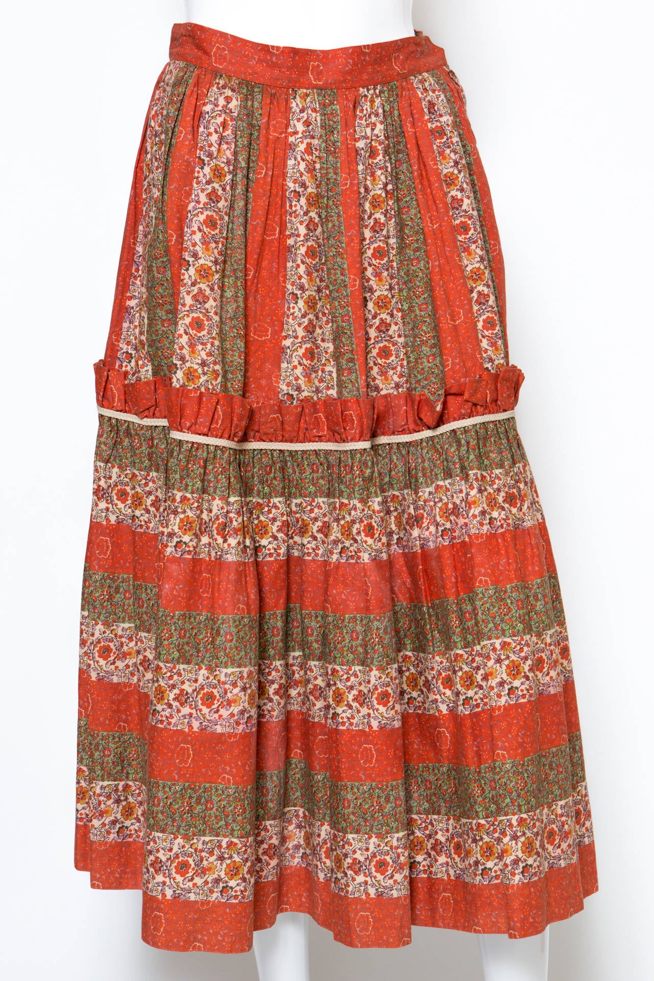 Gorgeous multicolour cotton floral print peasant skirt from Yves Saint Laurent gets a waistband, a pleated design and side pockets.
In excellent vintage condition. Made in France.
We guarantee you will receive this skirt as described and showed on
