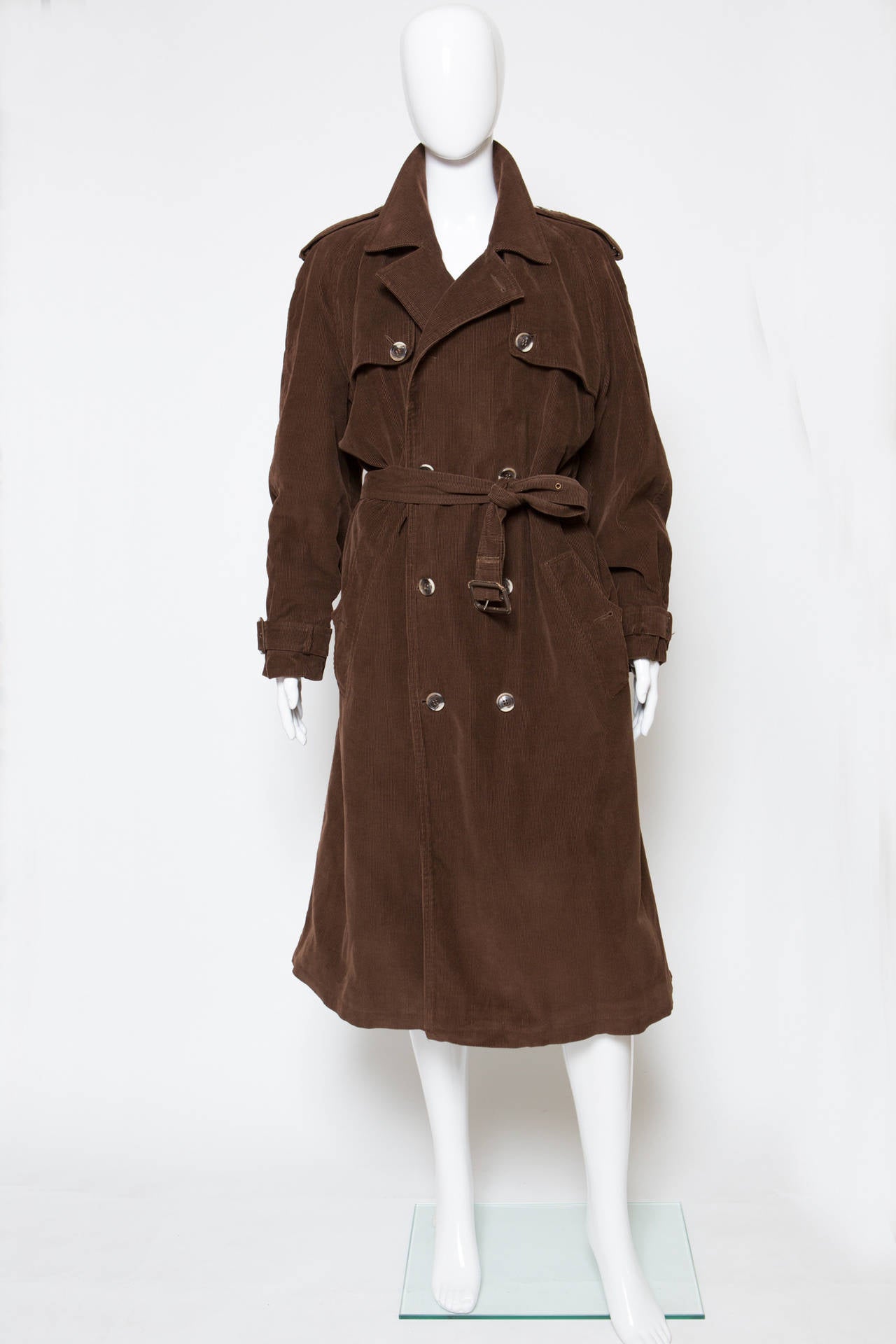 1967s rare chocolate brown Yves Saint Laurent velvet cotton classic trench featuring notched lapels, a double breasted front fastening, a belted waist, side pockets, long sleeves, a storm flap and a soft quilted lining. This trench is a fantastic