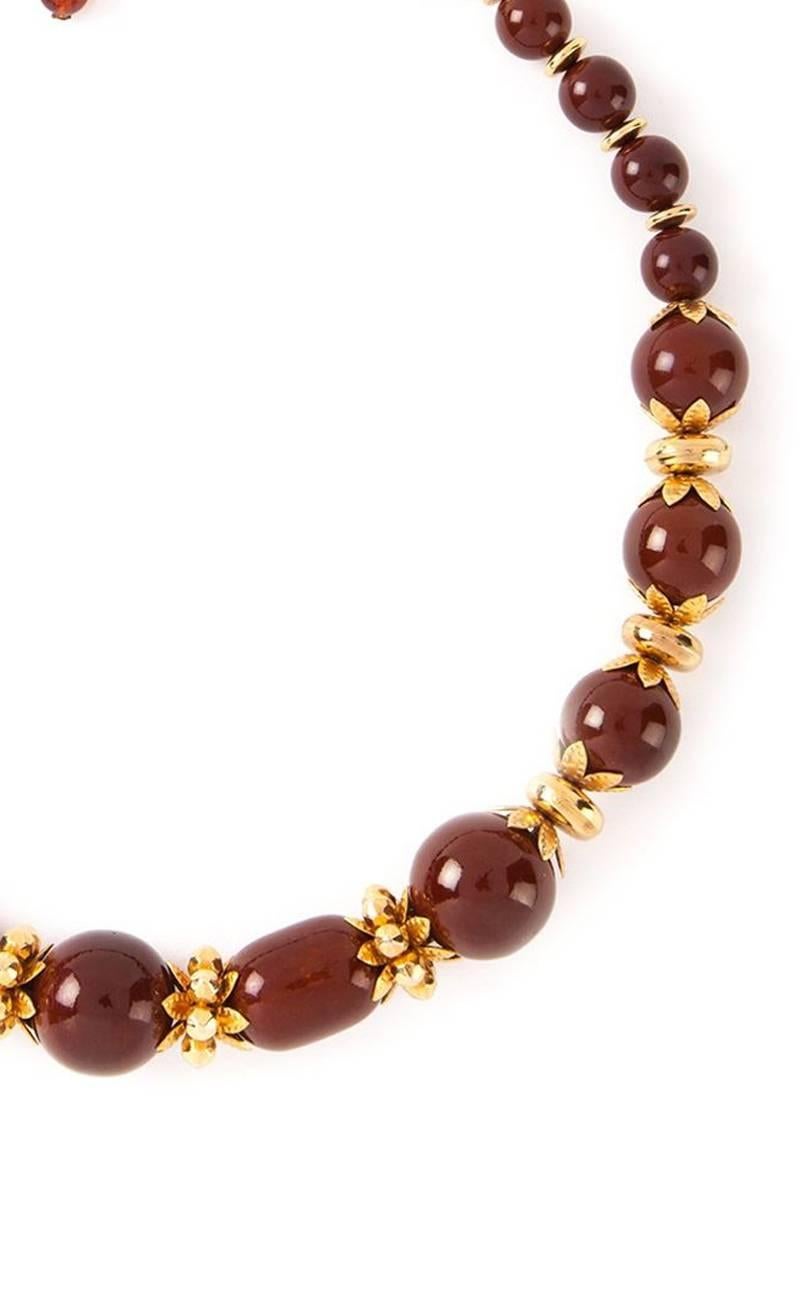 1970s rare collection Yves Saint Laurent bordeaux short necklace featuring gold-tone  metal beaded, with fancy bordeaux beads a marked YSL .
 Length 20,4 in. ( 52 cm )
In excellent vintage condition. Made in France.
We guarantee you will receive