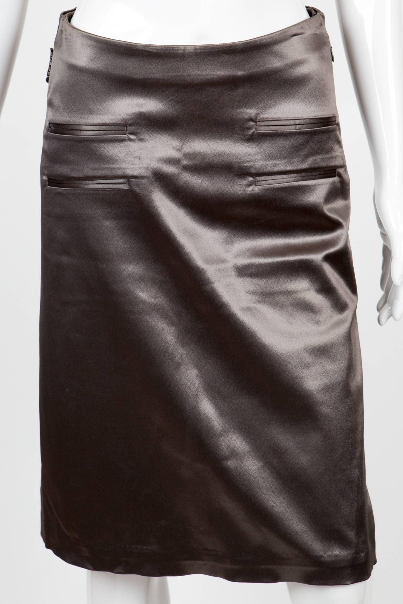 1980s Chanel taupe satin skirt featuring 4 front pockets, a back waist elasticated, a logo tag at side seam.
In excellent vintage condition. Made in France.
Waist in. ( cm)
Length in. ( cm)
Estimated size:36fr
