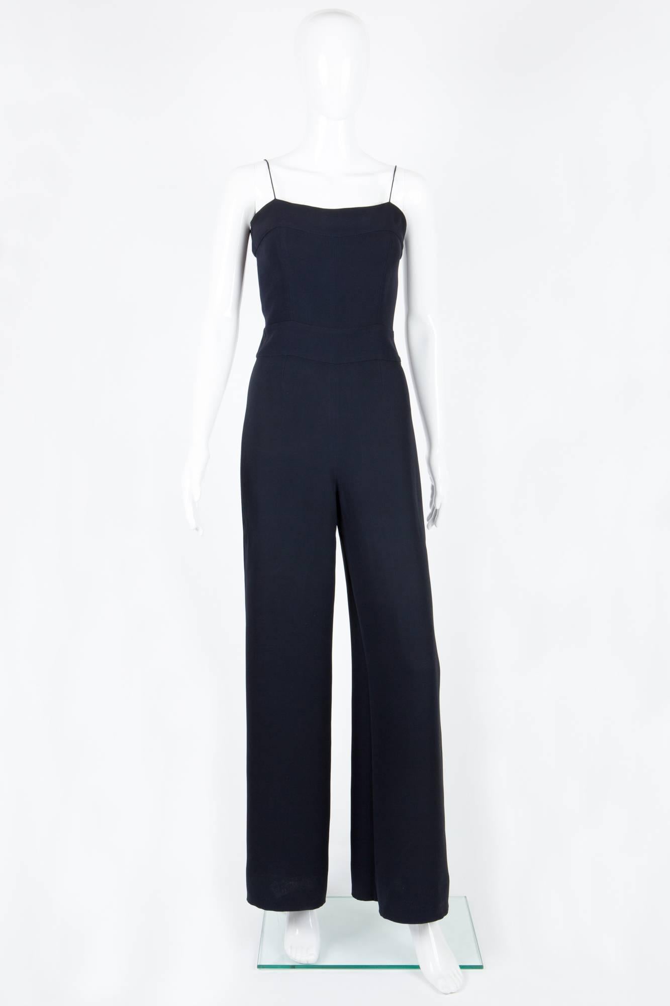 1990s gorgeous Collector black Chanel jumpsuit featuring thin spaghetti straps,a center back logo zip. This model was the same as wore by Audrey Tautou in N°5 pub.
In excellent vintage condition. Made in France.
Chest 31,4 in. ( 80cm)
Waist