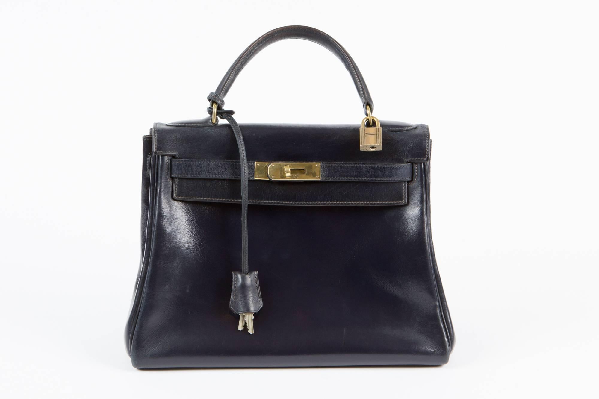 Fabulous 1965-70, Hermes Vintage navy Kelly bag in 28cm, this classic bag features gold- plated hardware and comes with it's original clochette, lock and  2 keys.
Exceptional, rare and collectable Kelly of the 60s. 
Marked Hermès Paris, Letter RZ