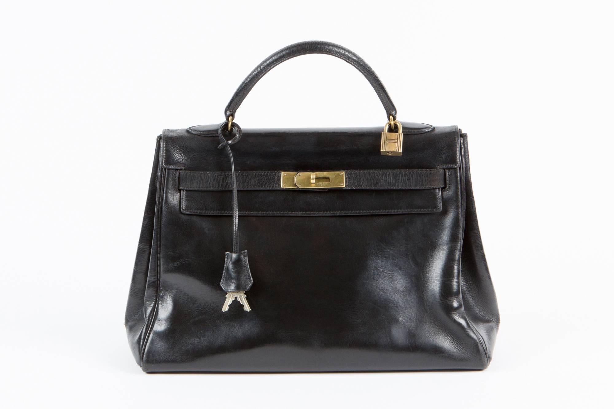 Fabulous 1965-70, Hermes Vintage black Kelly bag in 32cm, this classic bag features gold- plated hardware and comes with it's original clochette, lock, 2 keys, and shoulder strap. 
Exceptional, rare and collectable Kelly of the 60s. 
Marked