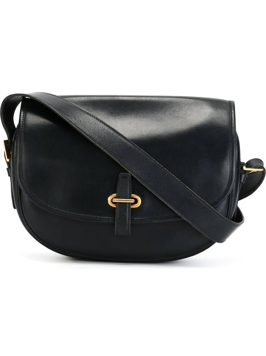 Navy blue lamb skin 'Balle de golf' Hermès shoulder bag from featuring an adjustable shoulder strap with a gold plated hook, internal compartments and a zipped pocket. 
First 