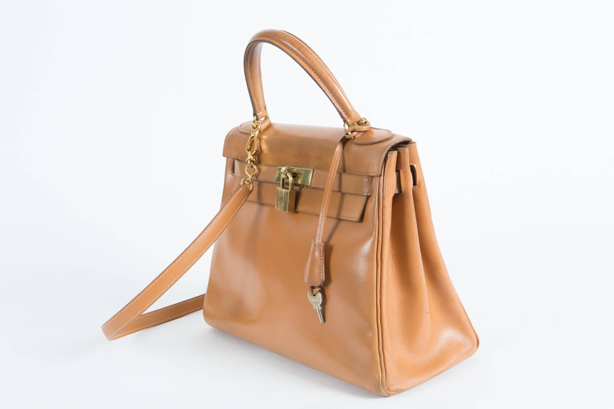 Fabulous 1965-70, Hermes Vintage Kelly bag in 28cm, this classic bag features gold- plated hardware and comes with it's original clochette, lock, key, and shoulder strap (please note this camel boxcalf shoulder strap has been done by an Hermes