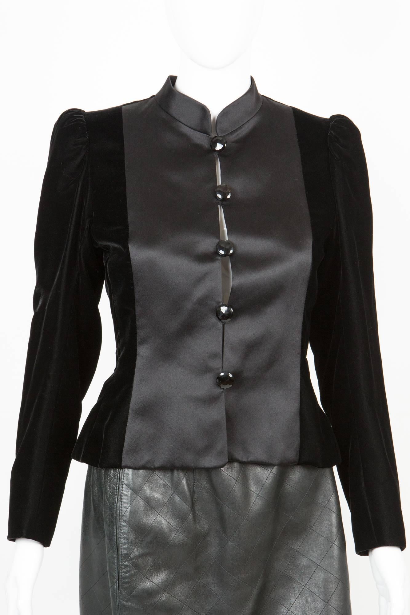 Rare Saint Laurent Couture numbered (46364) silk black jack featuring a satin silk front patch& collar, rest of jacket is in black silk velvet, front loop opening with black jais buttons, inside black quilted silk. 
In excellent vintage condition.