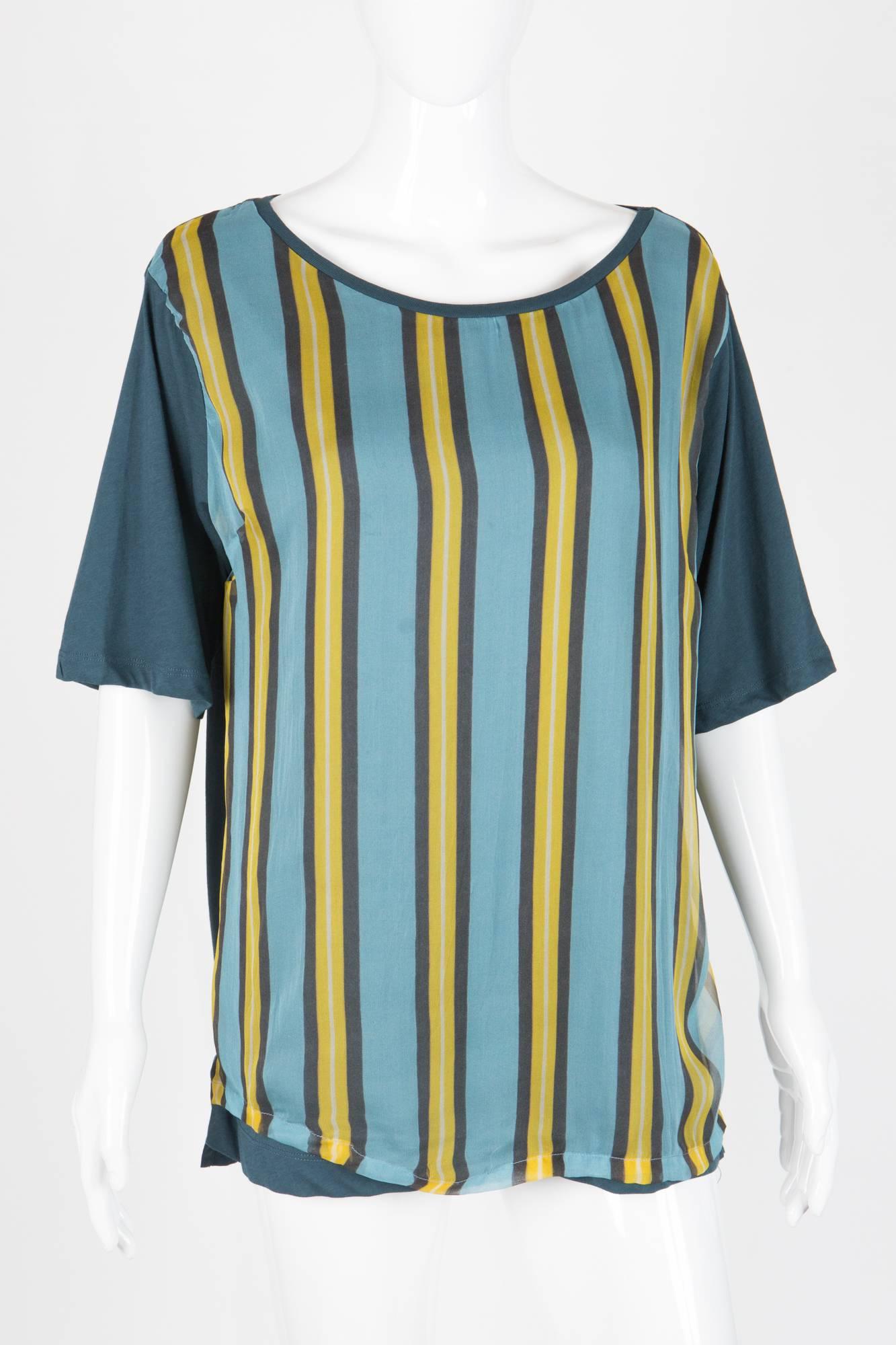 Blue and multi stripy Dries Van Noten top featuring able jersey top with a stripy silk jersey double front, sides slits. (82% cotton, 18% silk)
In excellent vintage condition. Made in France.
Label size Medium  
We guarantee you will receive this
