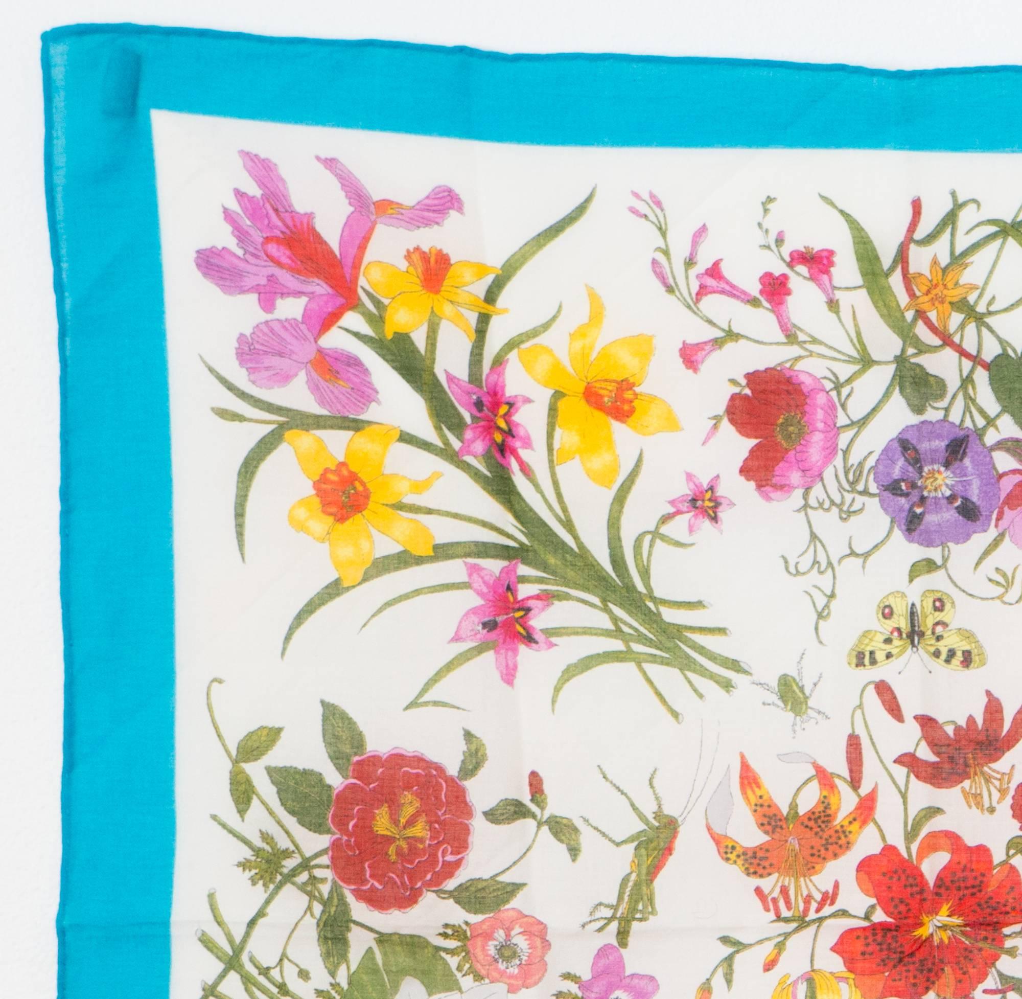 Gucci Flora printed cotton scarf featuring the famous and emblematic Accornero floral print,  turquoise border,  signed 'Gucci' and 'V. Accornero' (the artist's name) in the print.
In excellent vintage condition. Made in Italy
18,1in. (46cm) X 