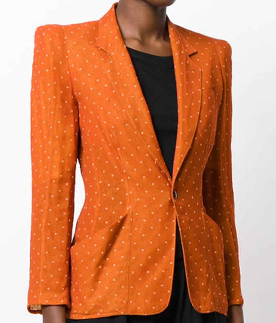 Orange Jean Paul Gaultier silk polka dot pattern blazer featuring notched lapels, a front button fastening, a chest pocket, two front pockets, a fitted waist, cropped sleeves, a straight hem and a full lining. 
In excellent vintage condition. Made