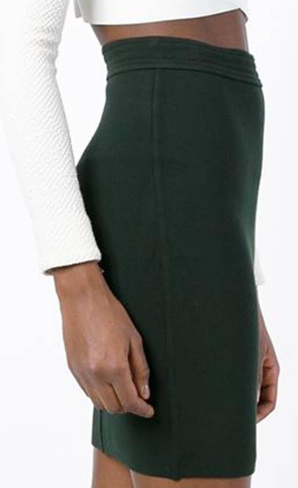 Azzedine Alaia forest green wool classic pencil skirt featuring a high rise, a waistband, and a mid-length. Circa 1980. 
In excellent vintage condition. Made in France.
Estimated size 36fr/ US4/ UK8
We guarantee you will receive this gorgeous item