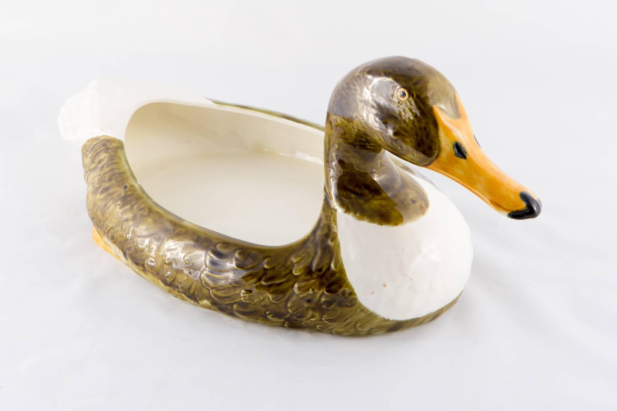 Rare large Christian Dior french hand-painted barbotine d'Onnaing duck pot featuring a cute duck with a large open space on his back (7.8in. (20cm) X 6,2 in. (16 cm) ), a back bottom signature.
In excellent vintage condition. Made in France.
Maximum