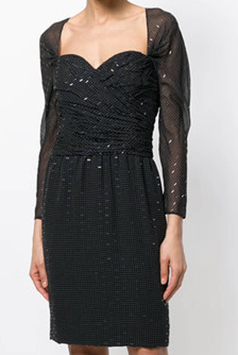 Christian Dior black mousseline printed silk dress featuring a white polka dot pattern, this party dress is embellished with clear embroidered detailing. With a feminine sweetheart neck, it features an invisible back zip fastening, long sheer