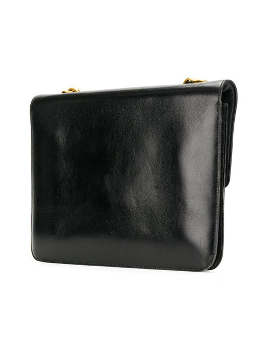 1970s Hermès black box calf leather shoulder bag featuring a detachable shoulder strap, gold-plated hardware, a foldover top and a main internal compartment.
 Marked Hermès Paris
In good vintage condition. Made in France.
We guarantee you will
