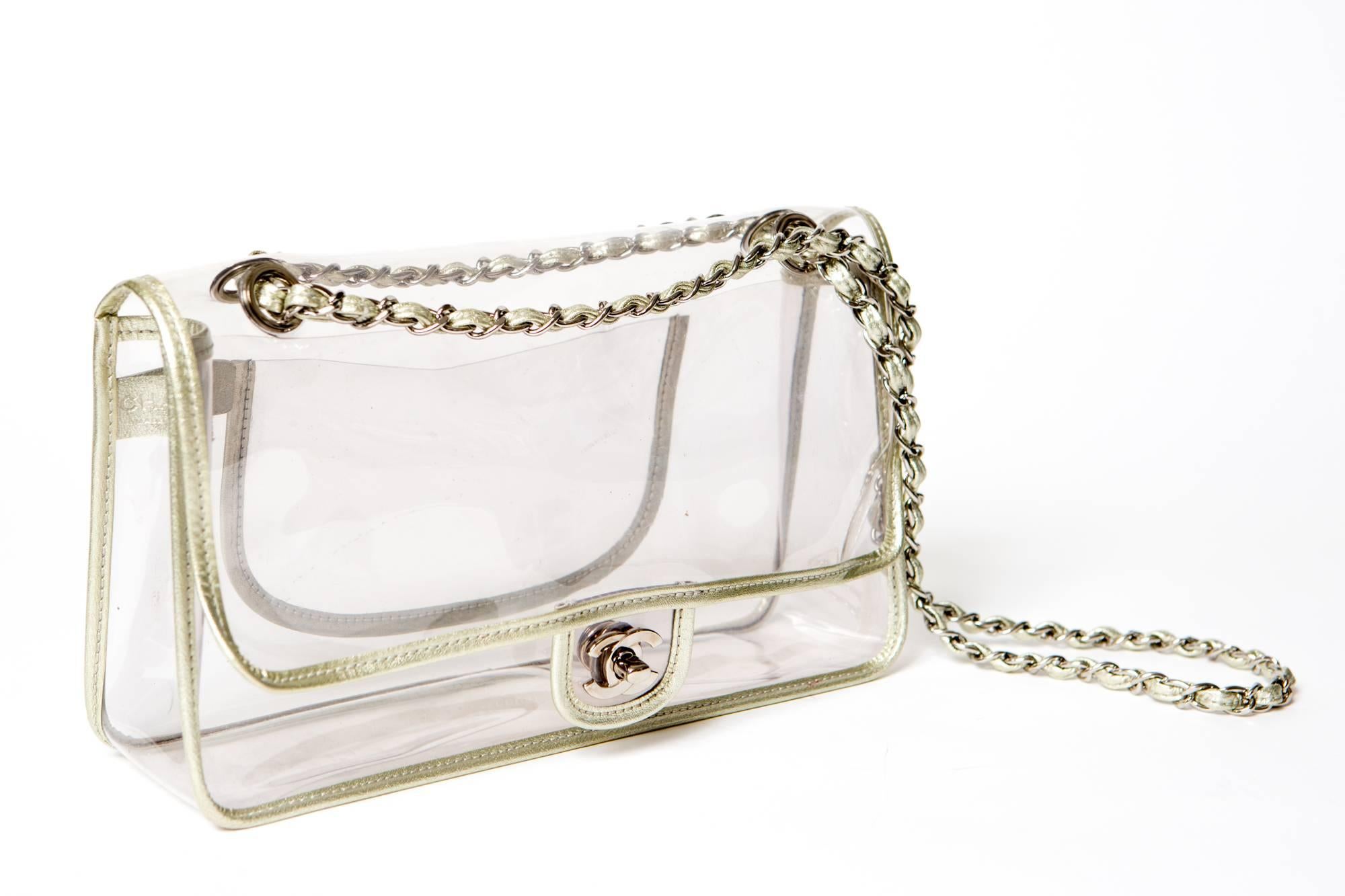 Collector 2.55 Chanel jelly transparent  bag limited edition featuring a white gold tone patent bias, all accessories are silver tone,a CC turn lock closures, a silver tone chain  110cm cross body, a back pocket:19cm x 10cm.
It comes with his black