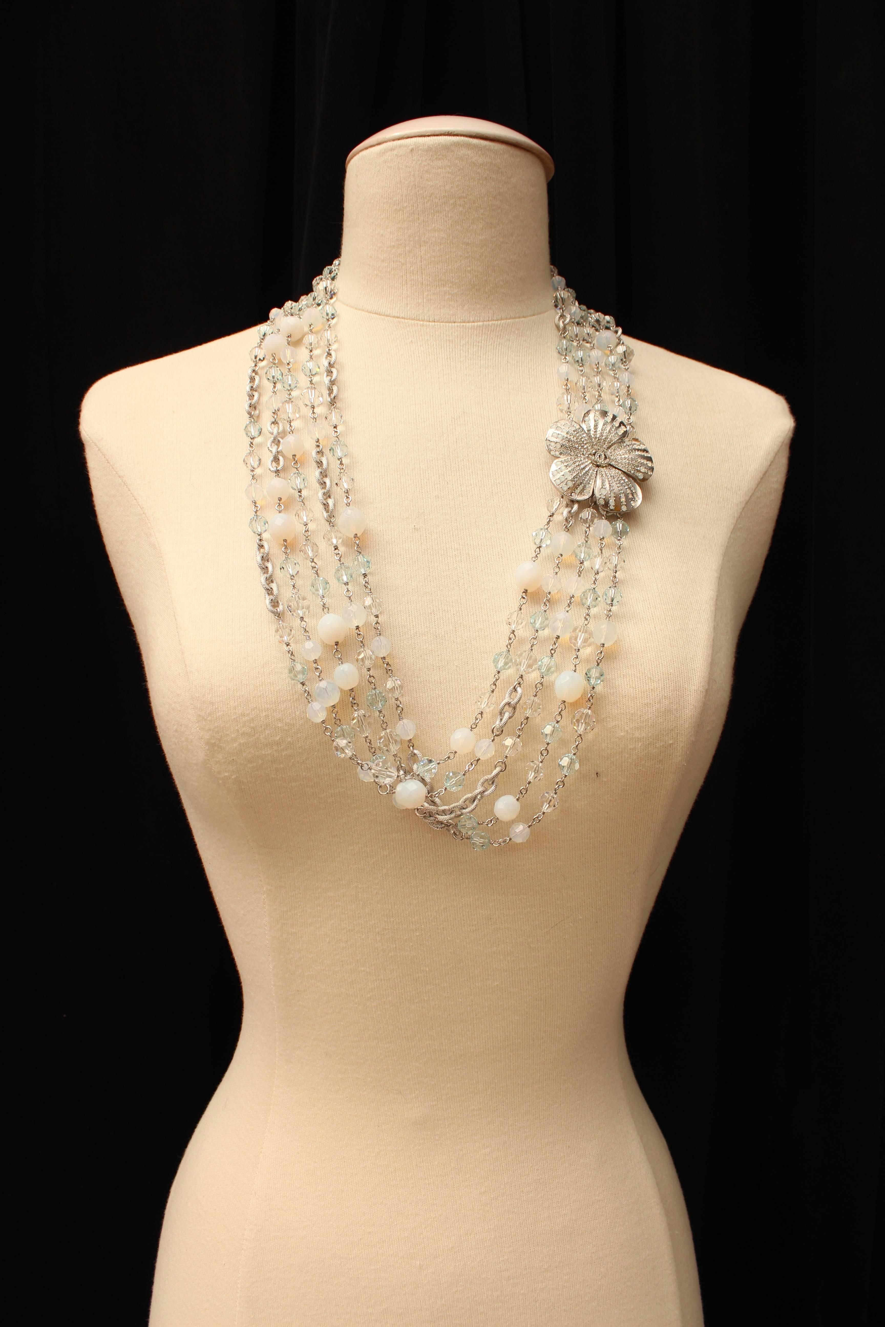 CHANEL (Made in France) Multi-row necklace from the Chanel Fall Winter 2007 collection, composed of five chiselled silver plate chains, alternating with transparent, iceberg blue and opalescent faceted Swarovski glass beads. The necklace is adorned